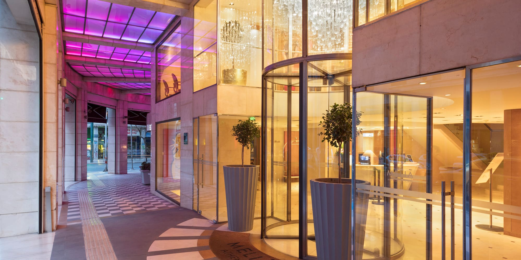 a building with glass doors and a chandelier