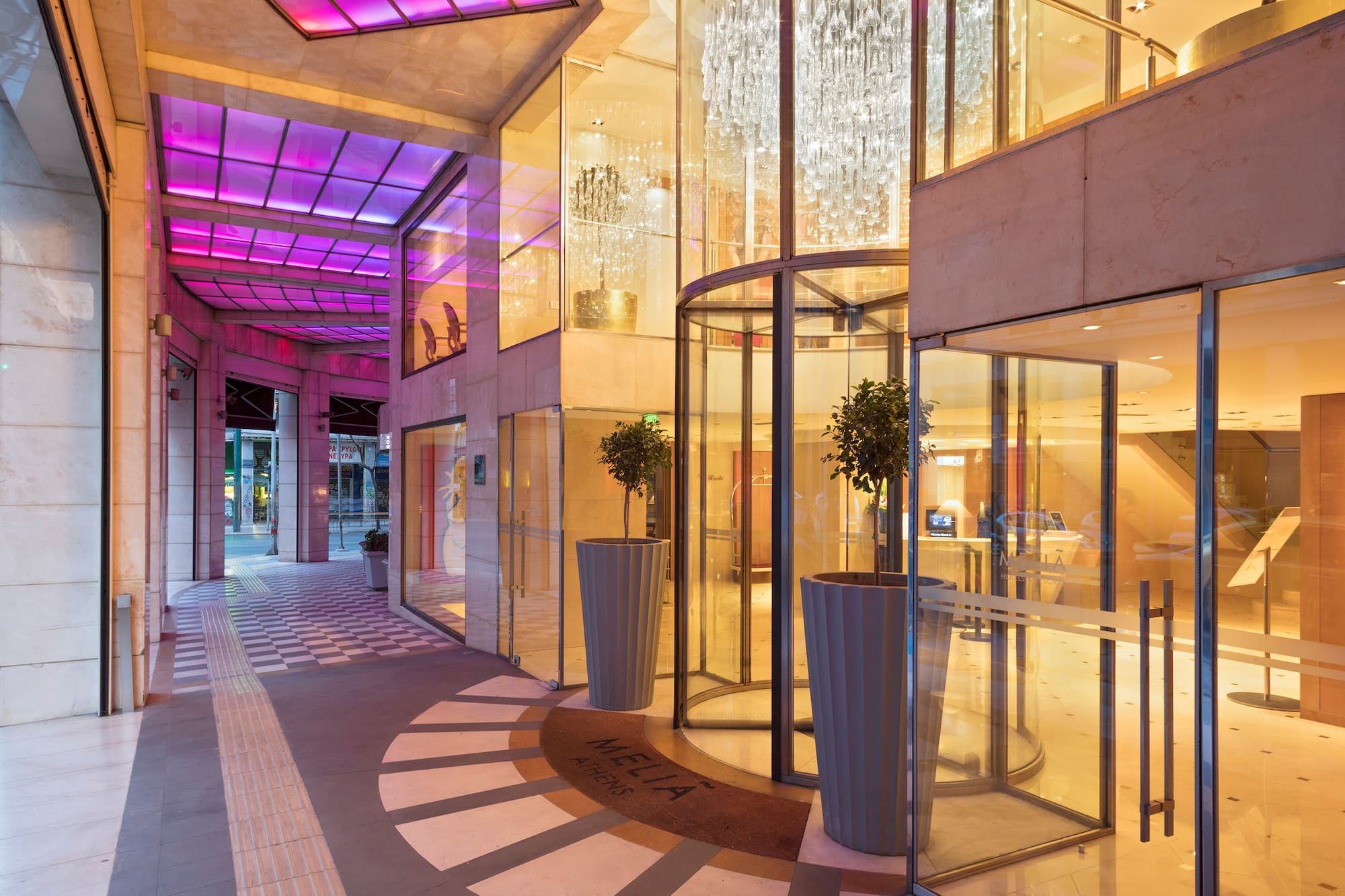a building with glass doors and a chandelier