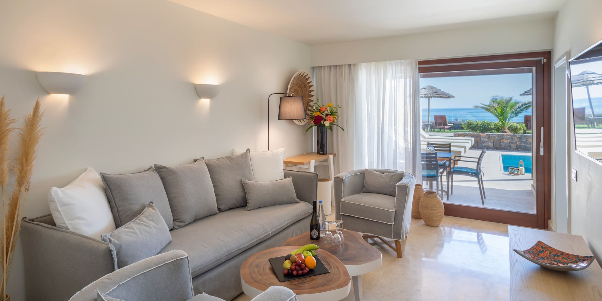 a living room with a couch and chairs