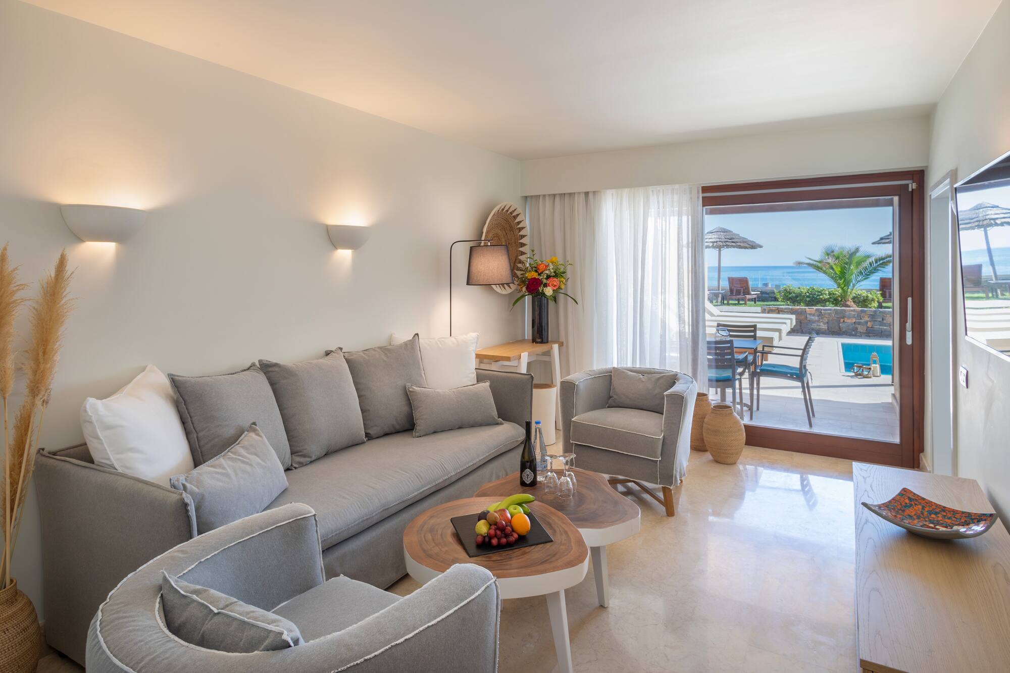 a living room with a couch and chairs