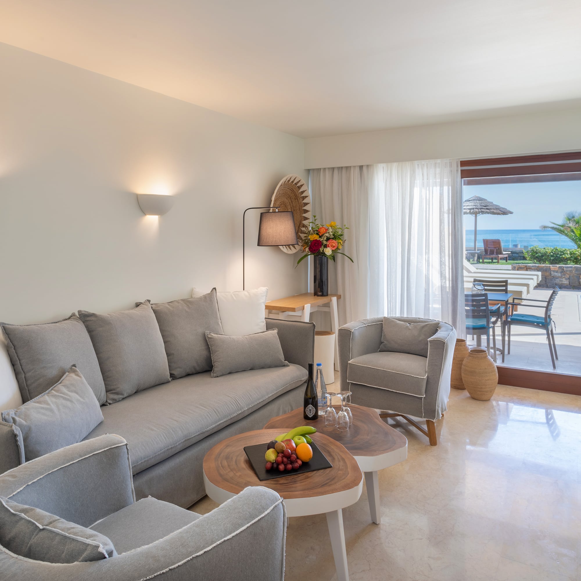 a living room with a couch and chairs