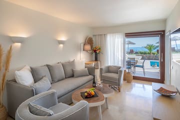 a living room with a couch and chairs