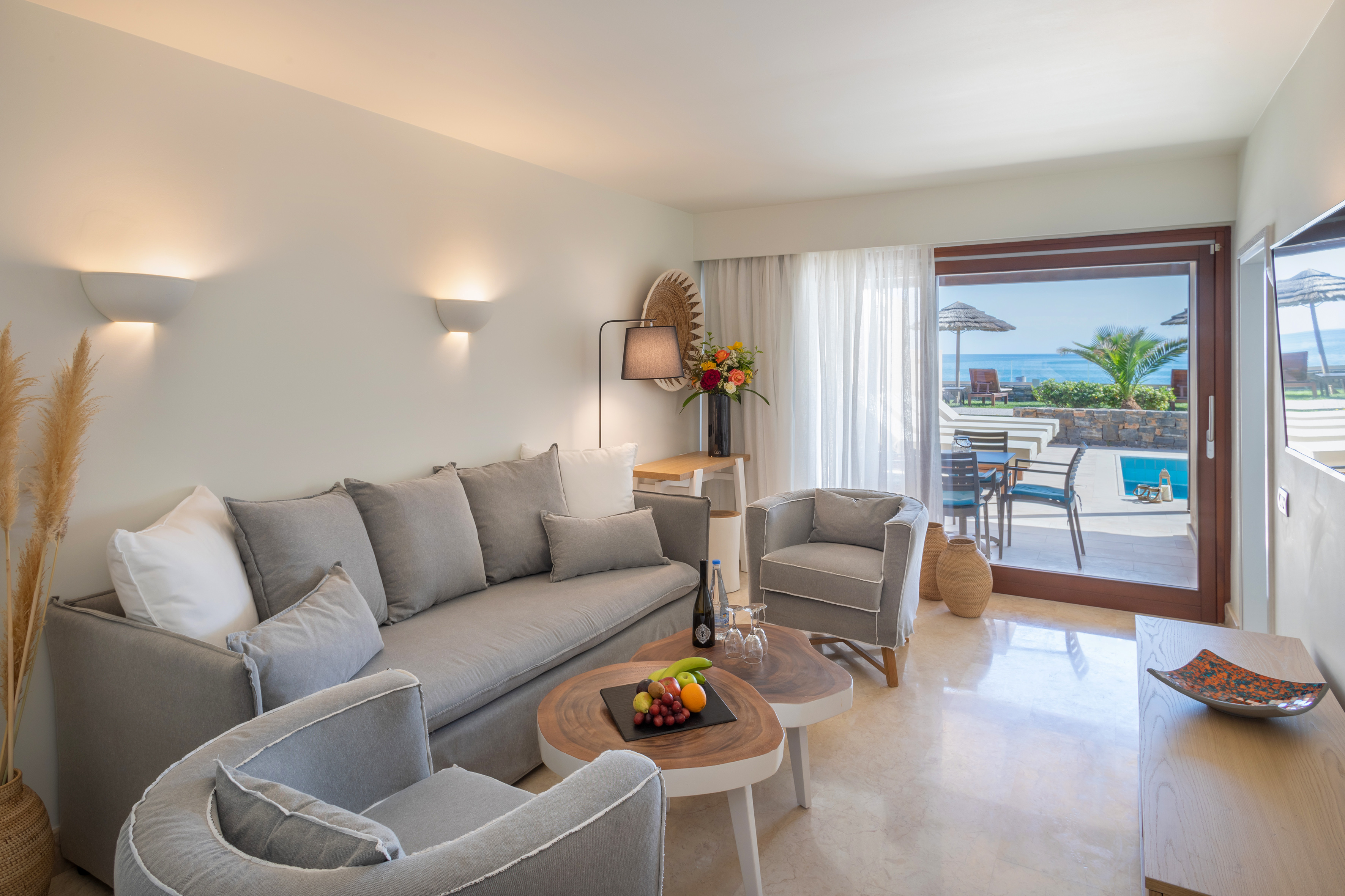 a living room with a couch and chairs