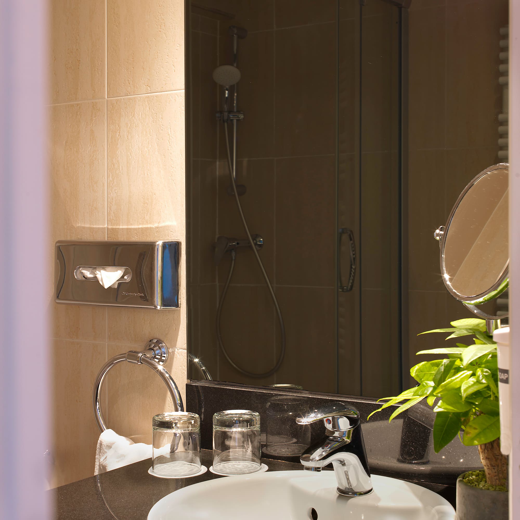 a bathroom with a sink and shower
