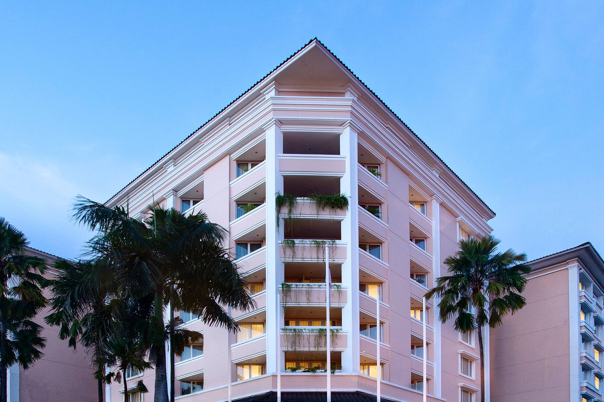 a building with palm trees