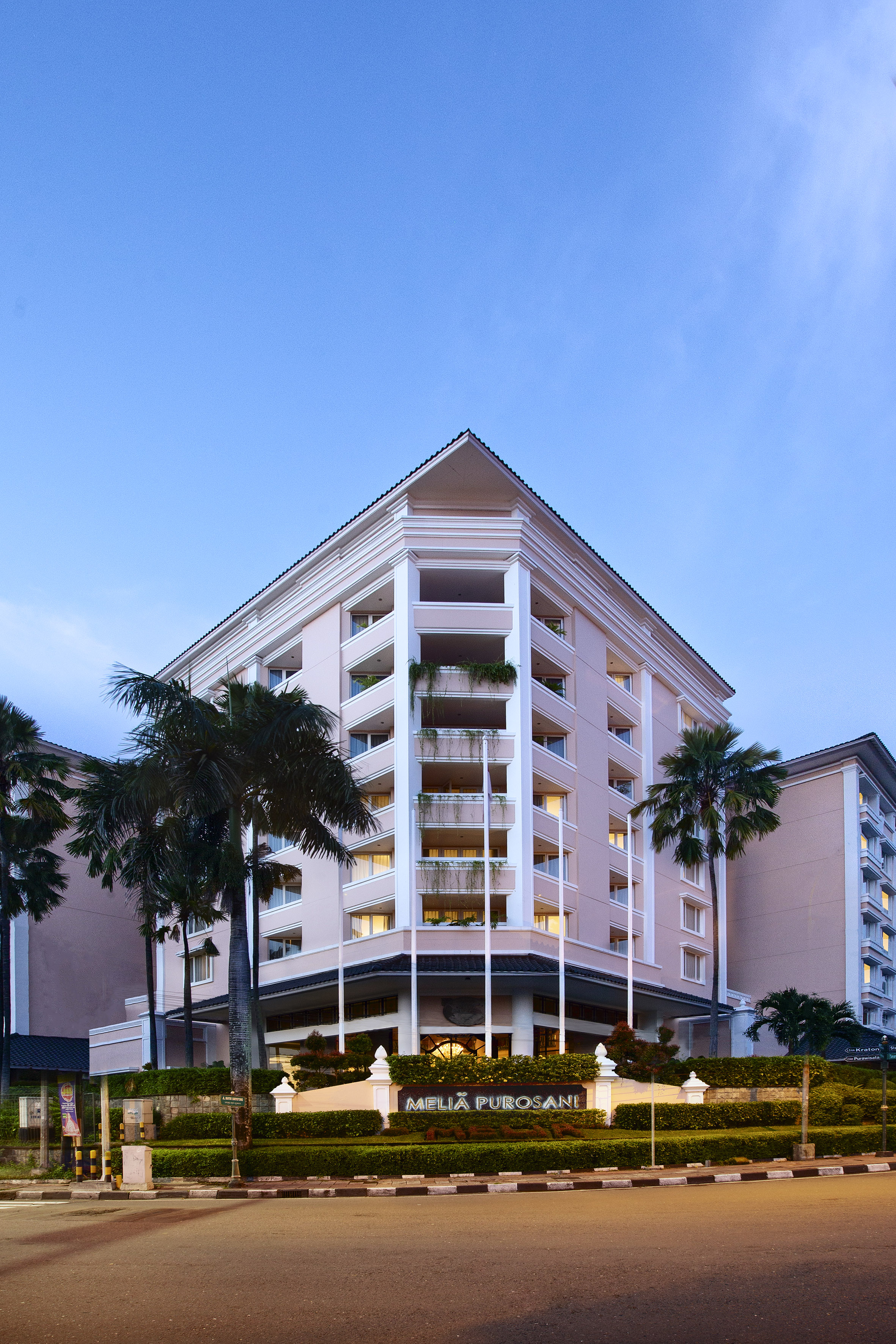 a building with palm trees