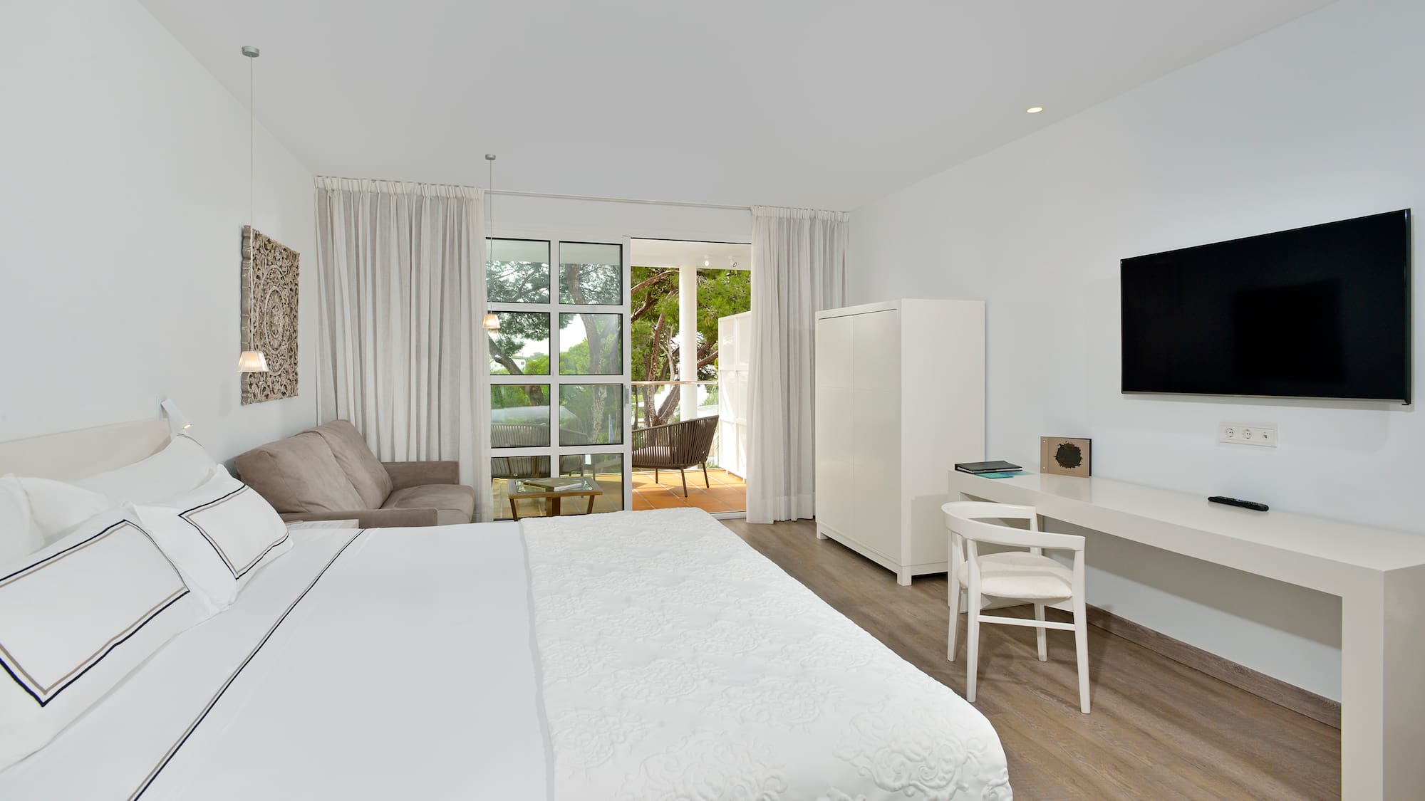 a bedroom with a bed and a tv