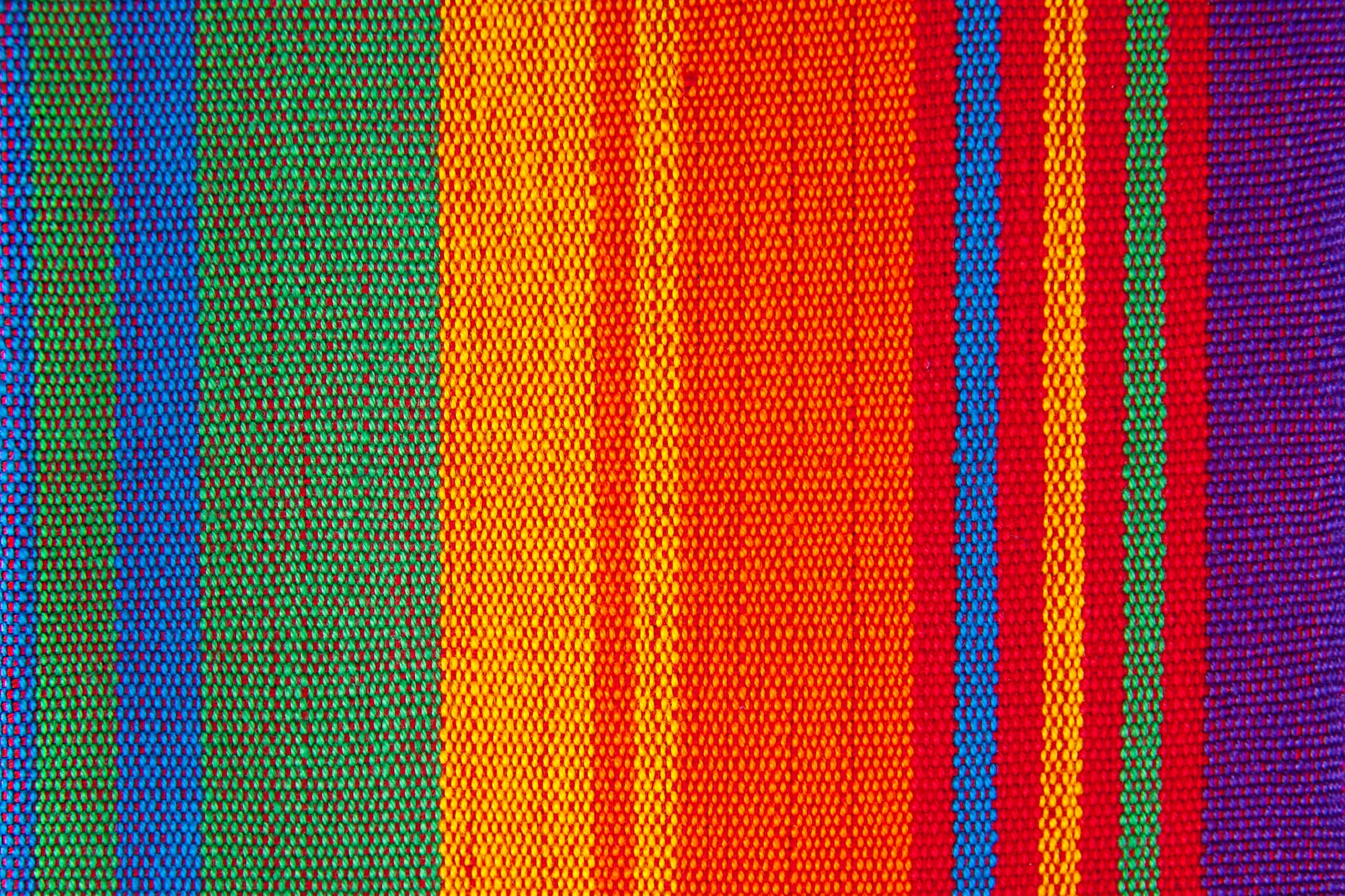 a colorful striped fabric with many colors