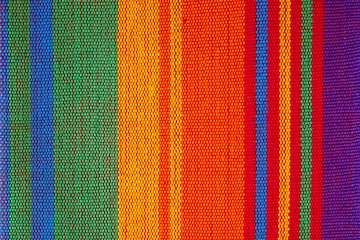 a colorful striped fabric with many colors
