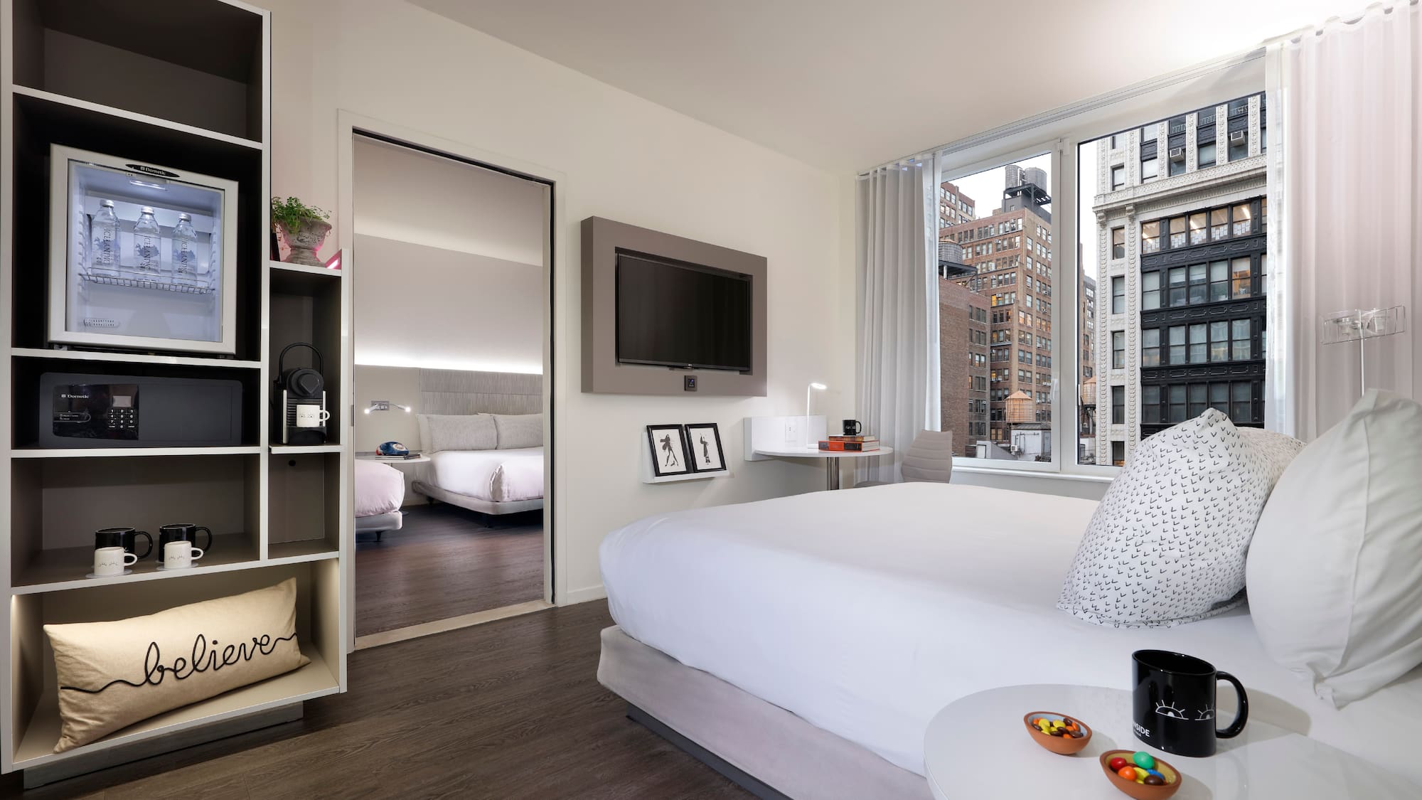 a bedroom with a bed and a tv