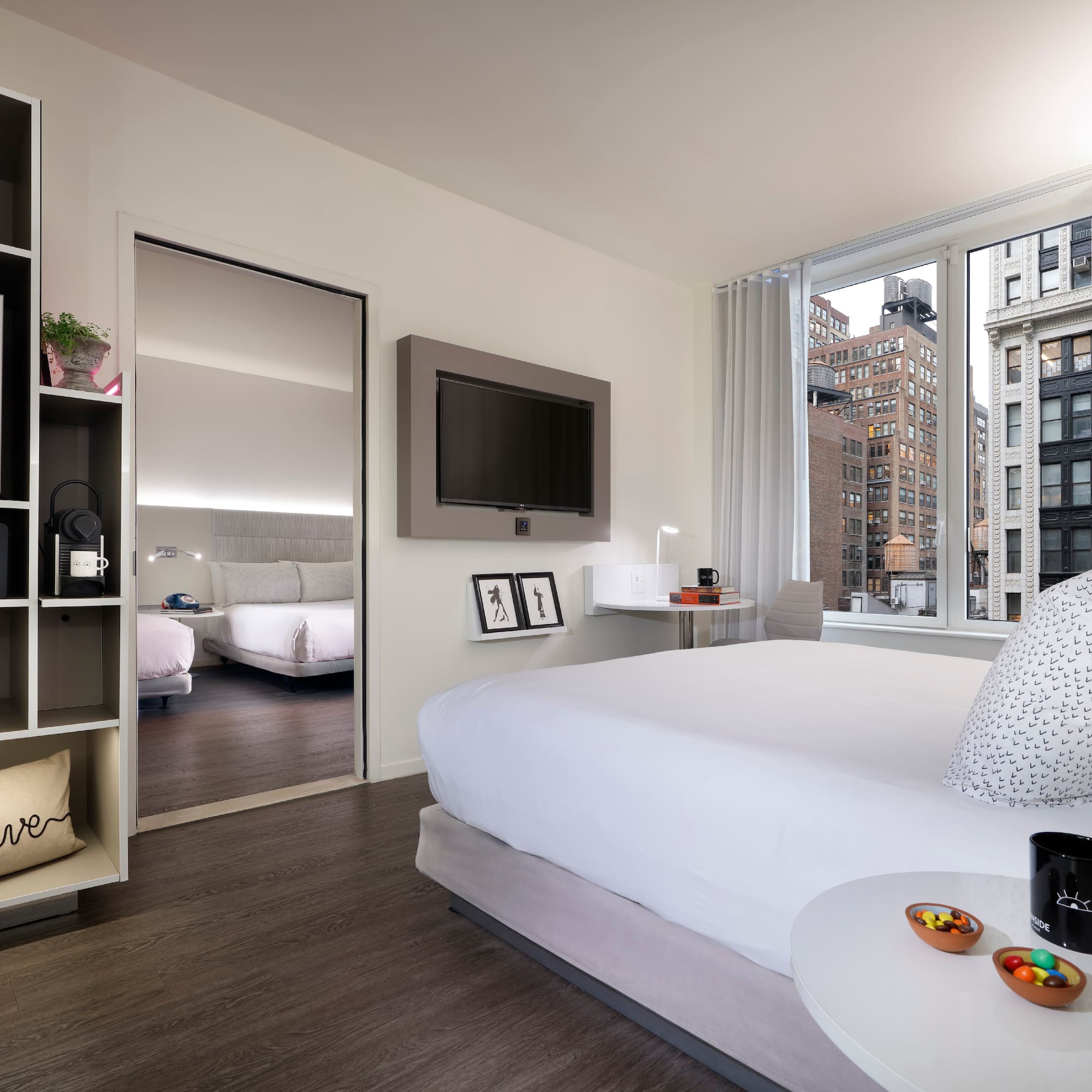 a bedroom with a bed and a tv