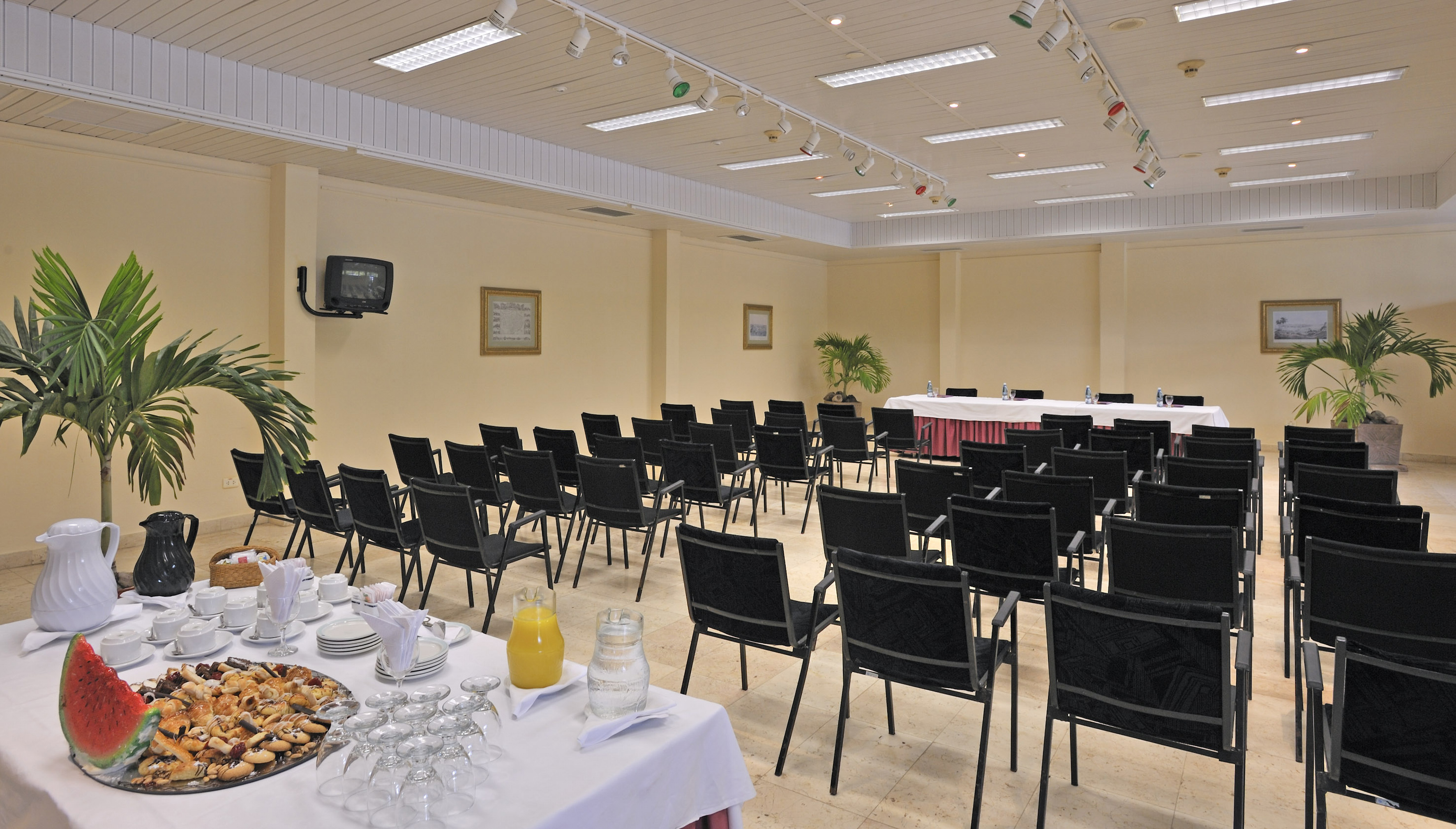 a room with a table set up for a conference