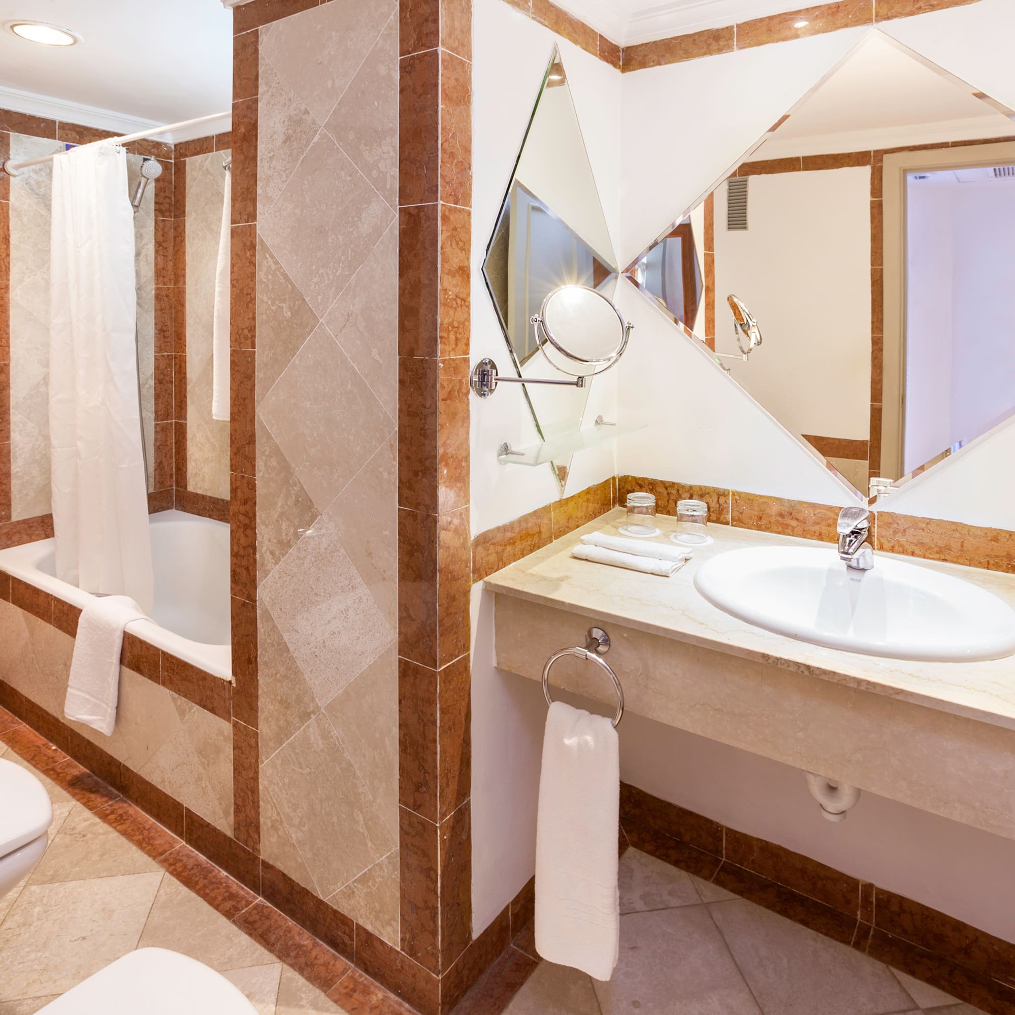 a bathroom with a mirror and sink