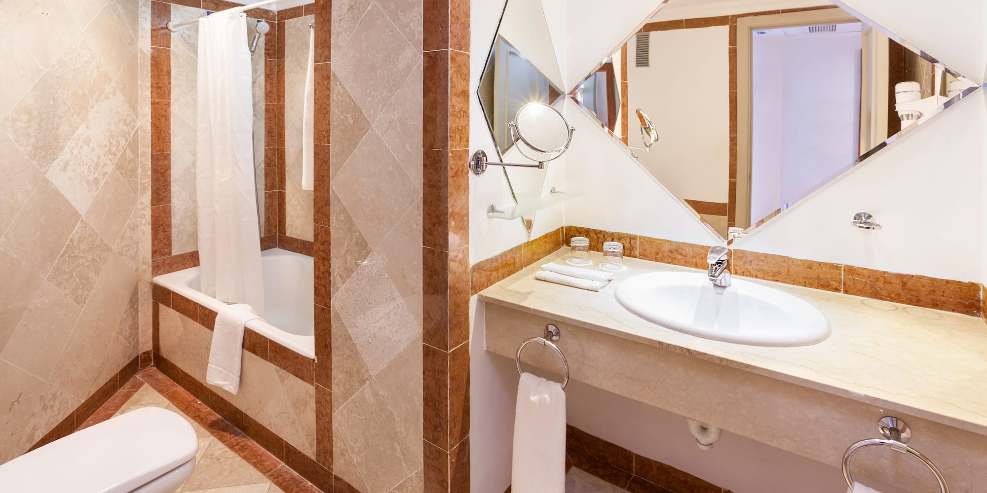 a bathroom with a mirror and sink