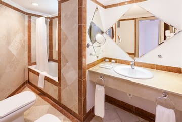 a bathroom with a mirror and sink