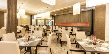 a room with tables and chairs