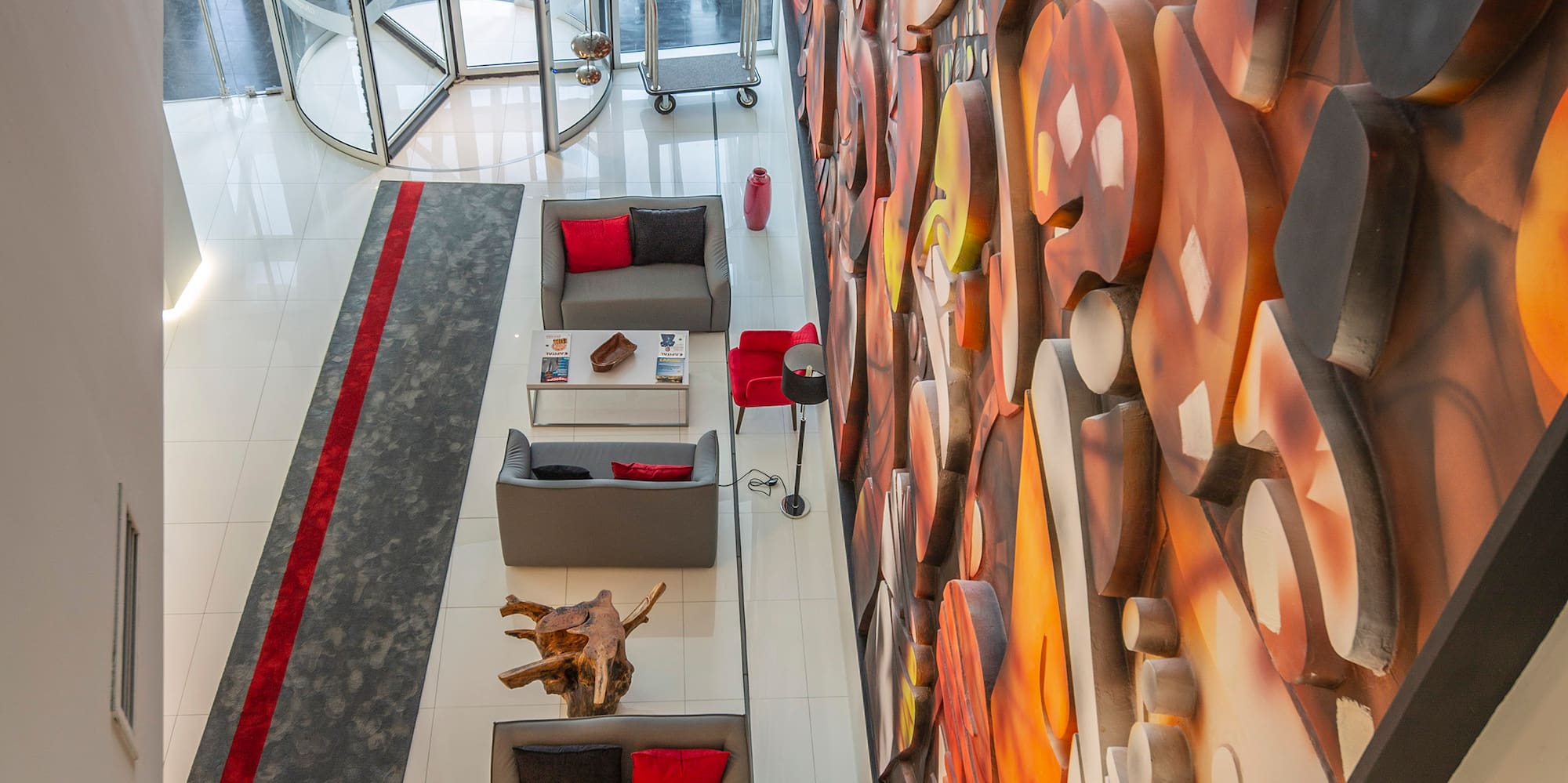 a room with a large mural on the wall