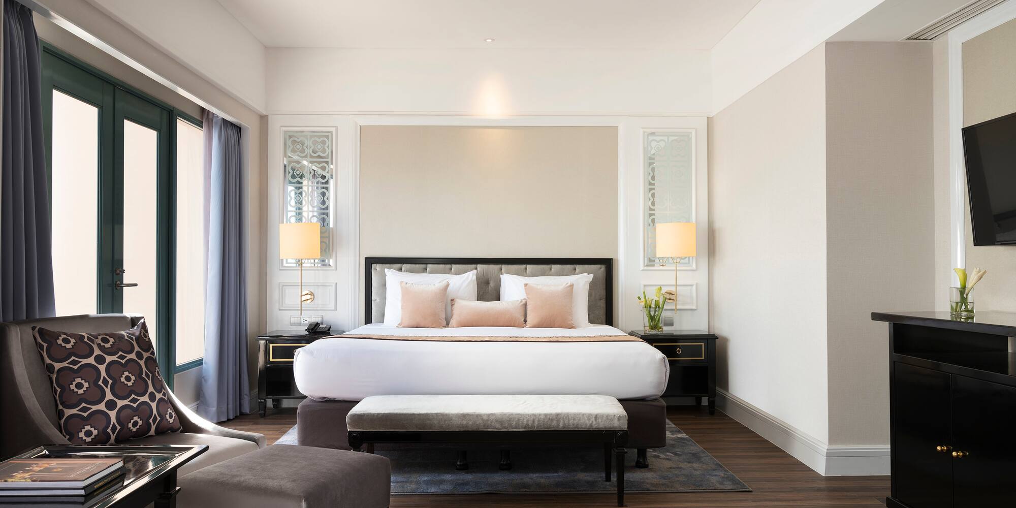 a bedroom with a bed and a chair