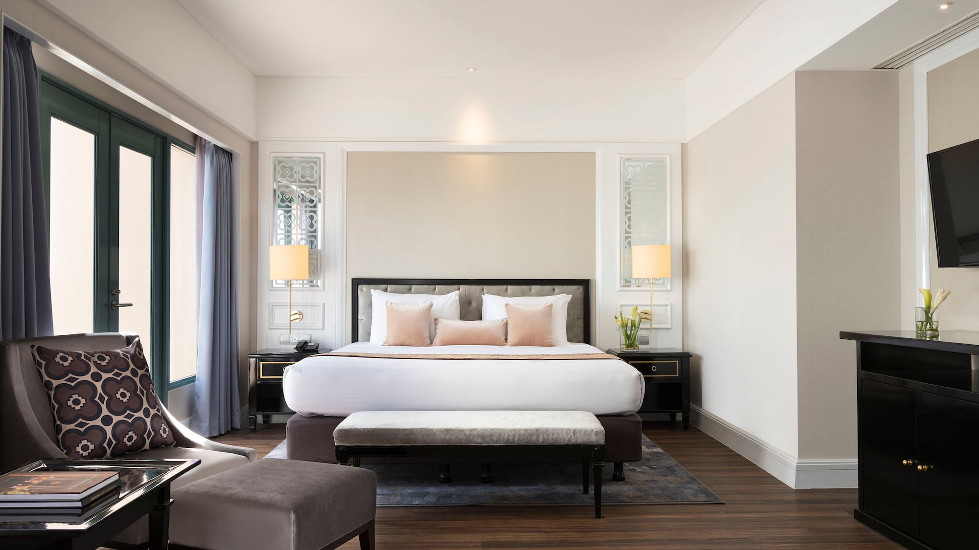 a bedroom with a bed and a chair