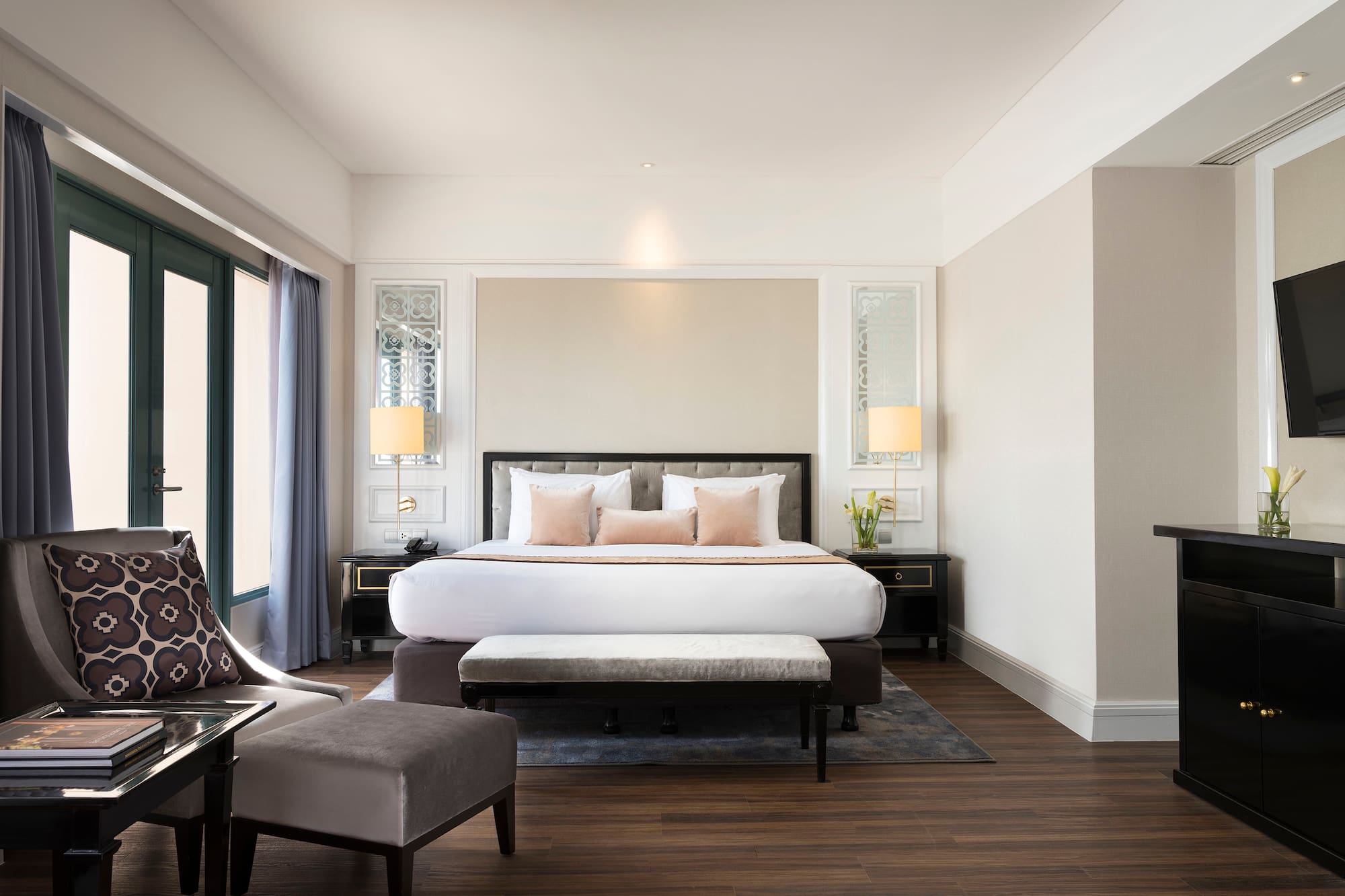 a bedroom with a bed and a chair