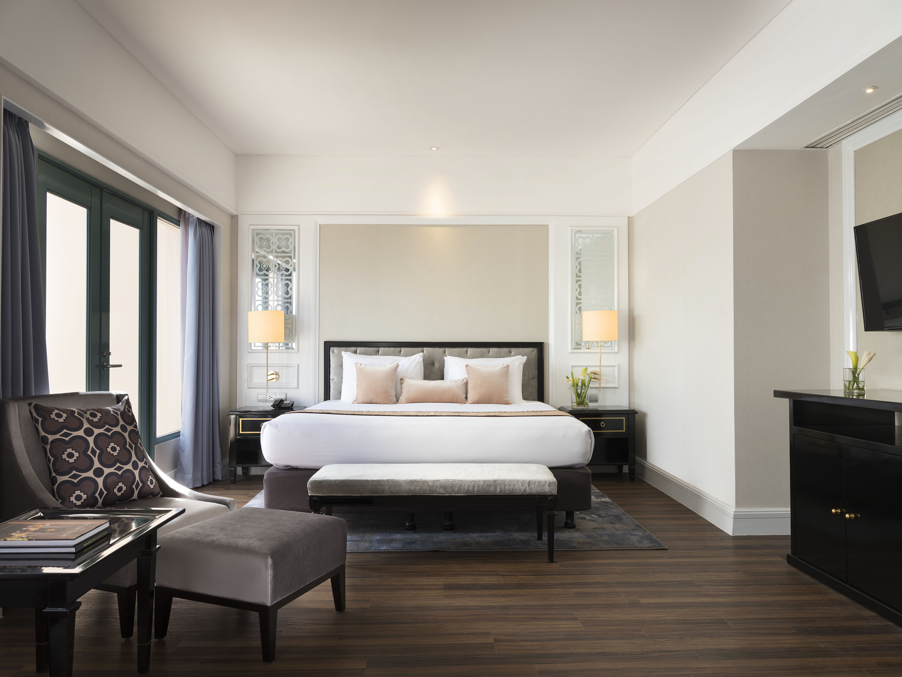 a bedroom with a bed and a chair