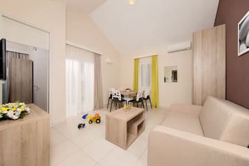 a living room with a table and chairs