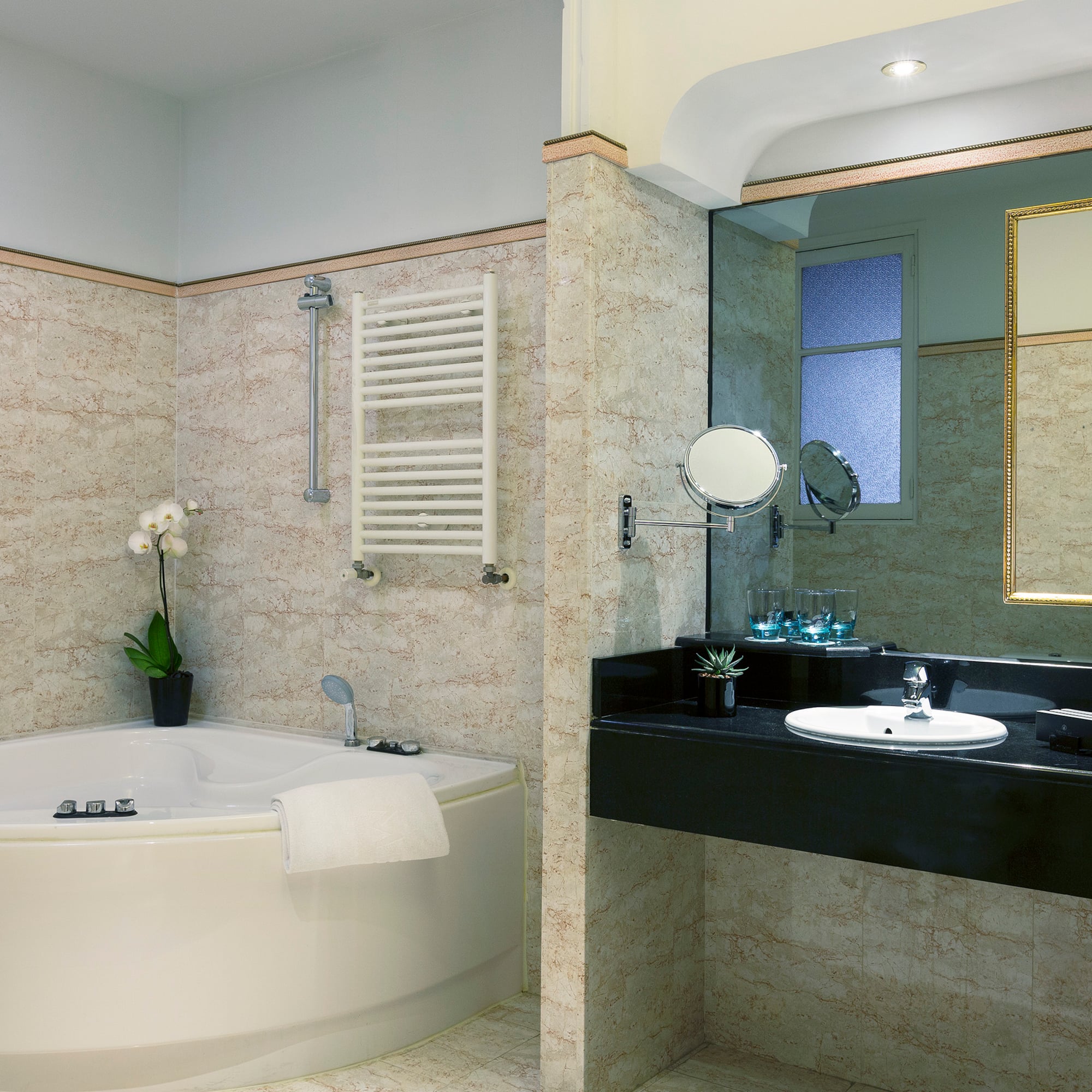 a bathroom with a tub and sink