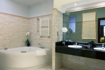 a bathroom with a tub and sink