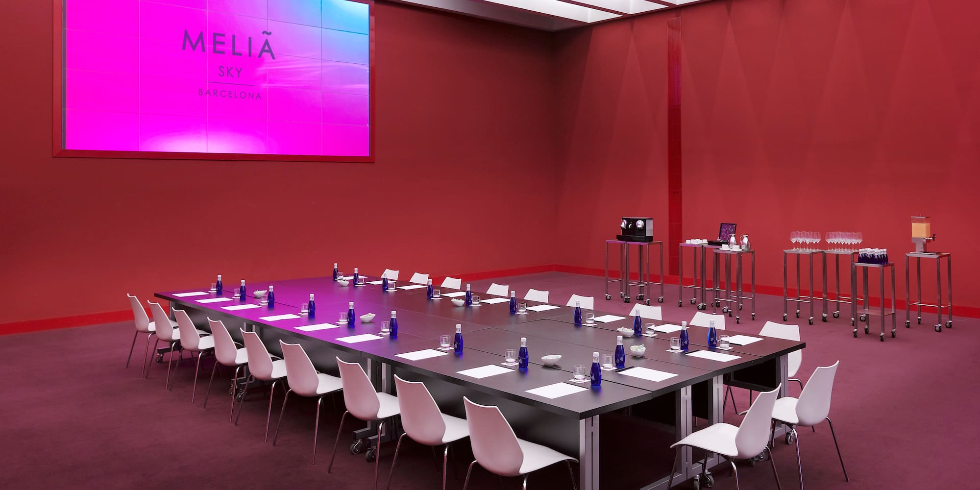 a long conference room with tables and chairs