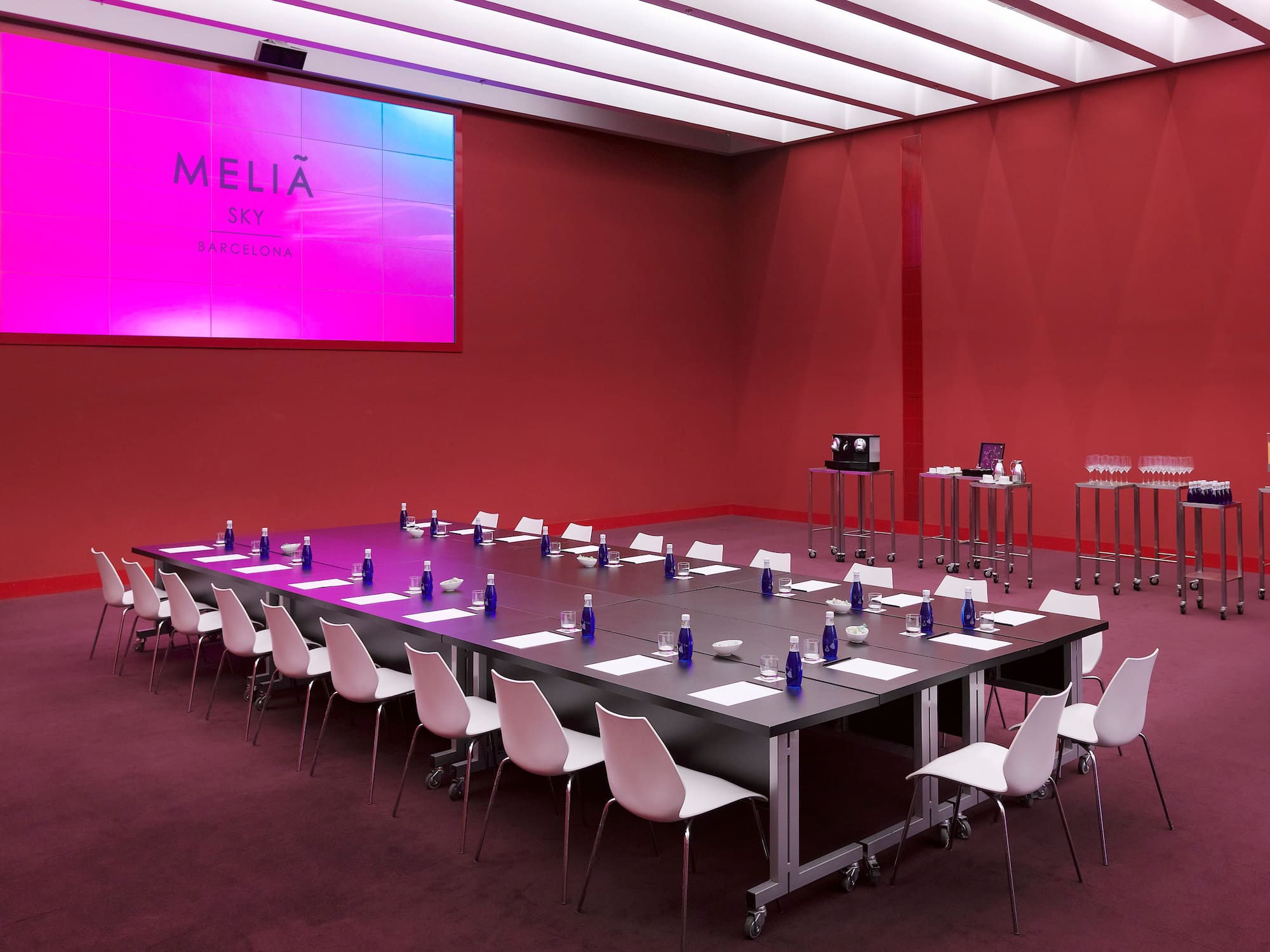 a long conference room with tables and chairs