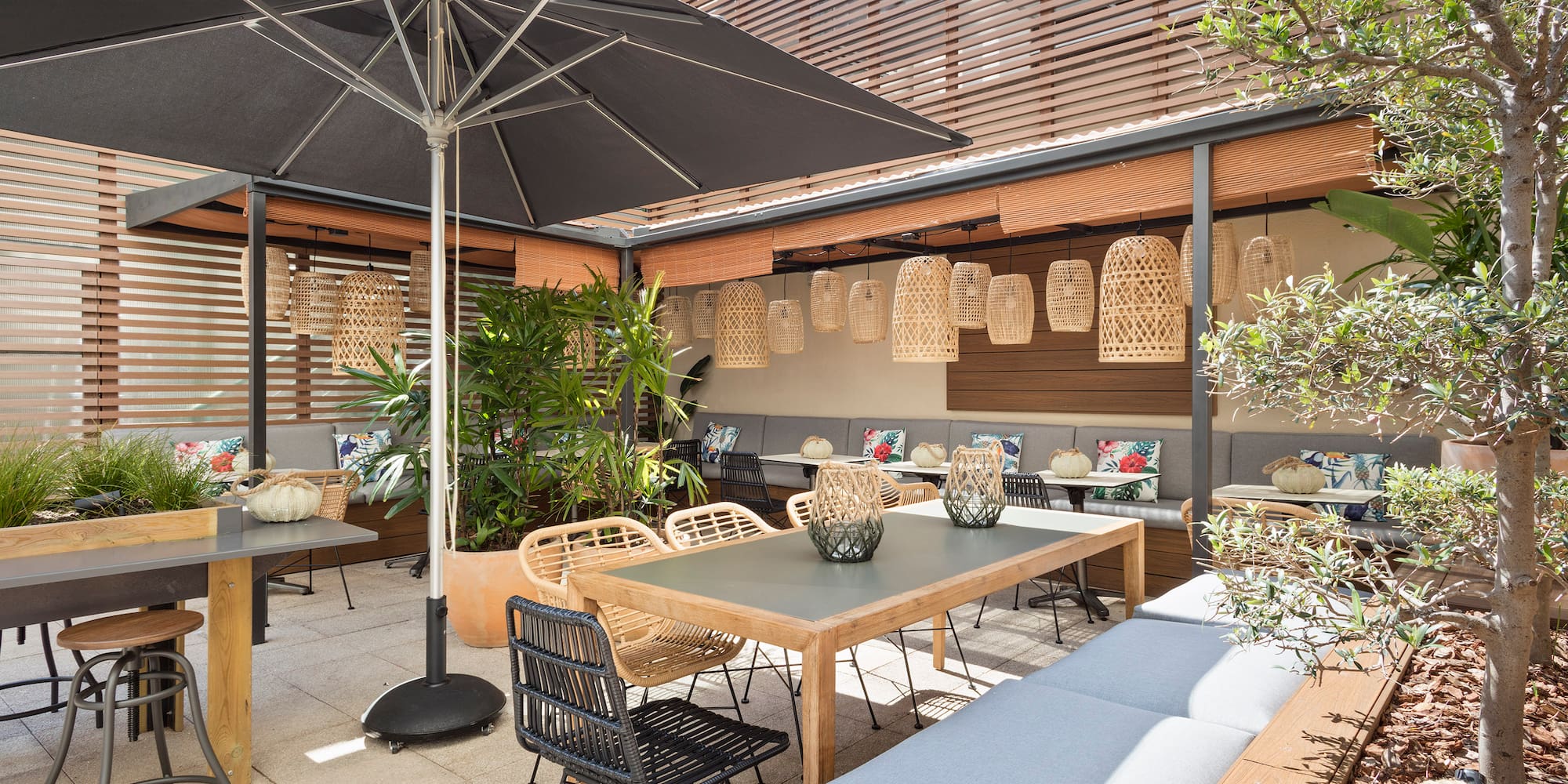 a patio with tables and chairs