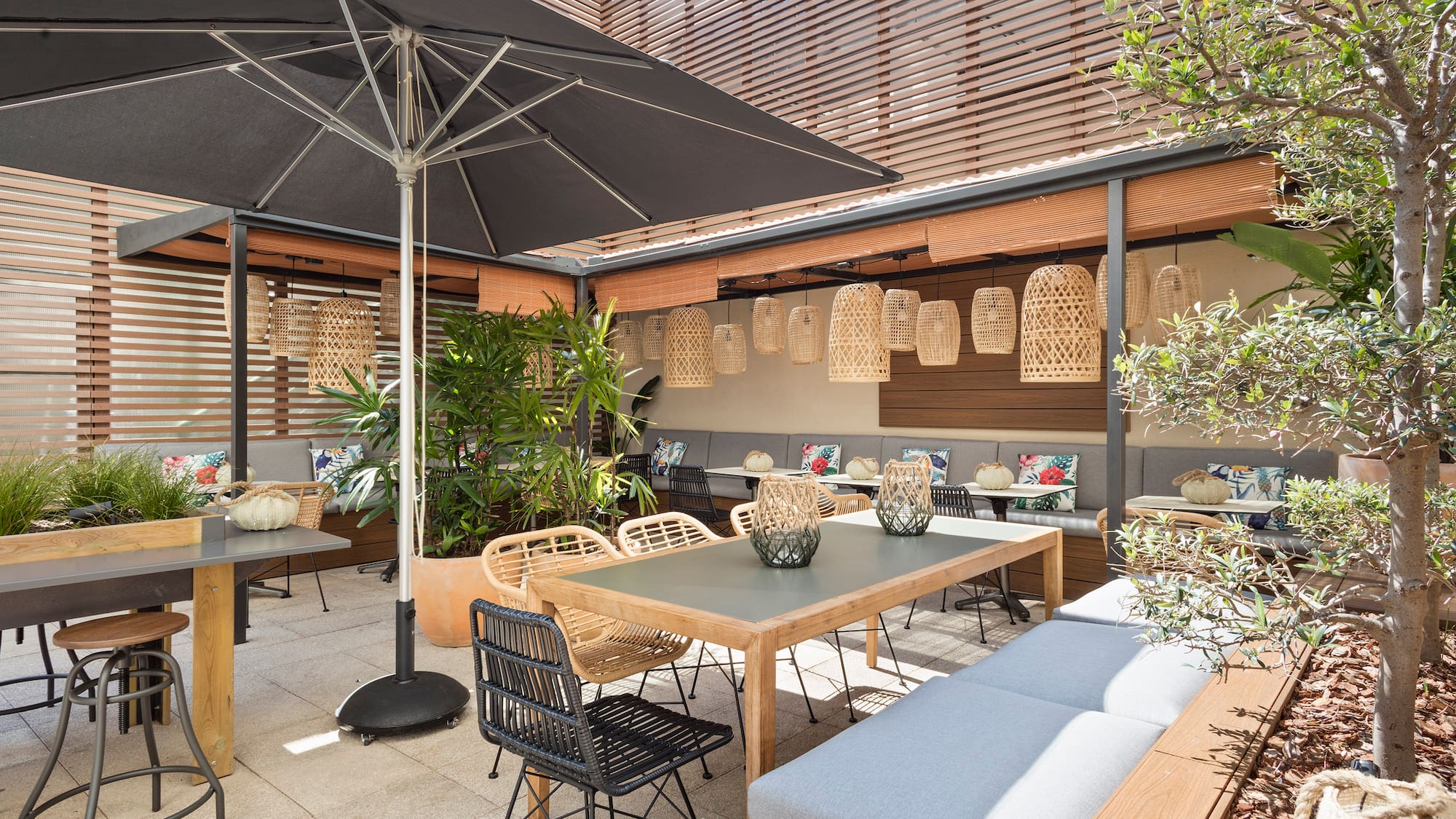 a patio with tables and chairs