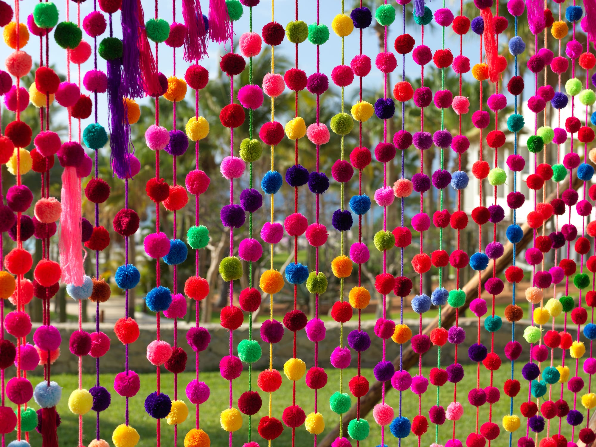 a colorful curtain with many balls