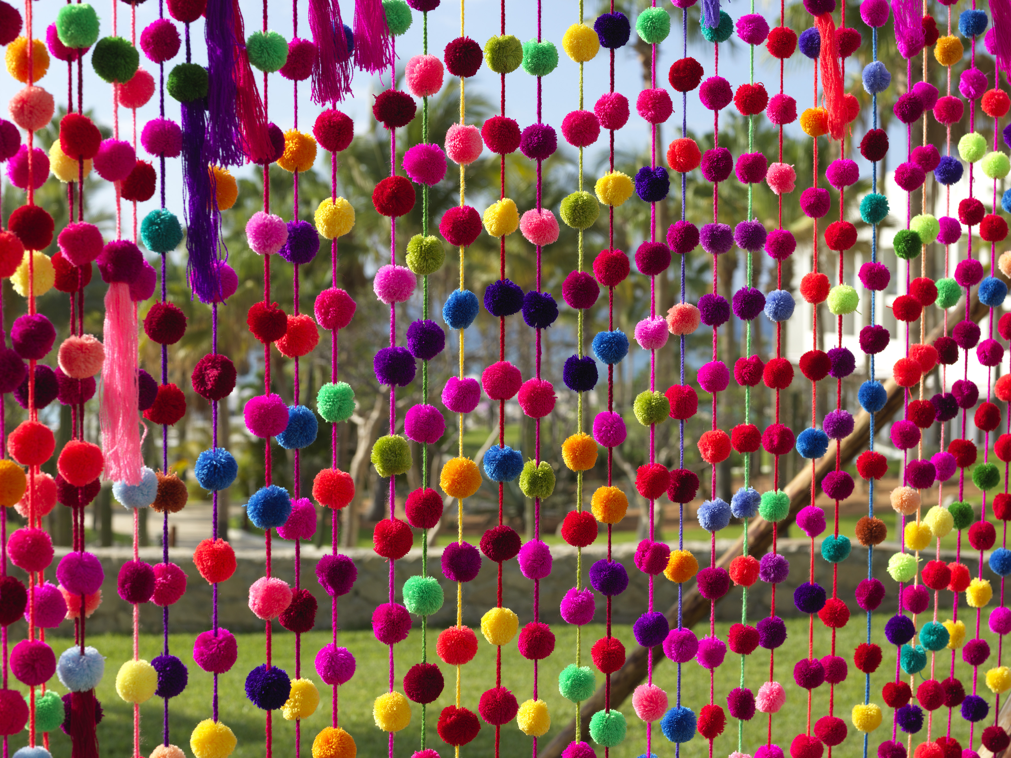 a colorful curtain with many balls
