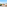 Balcony overlooking golf course, city skyline, and sea with outdoor seating.