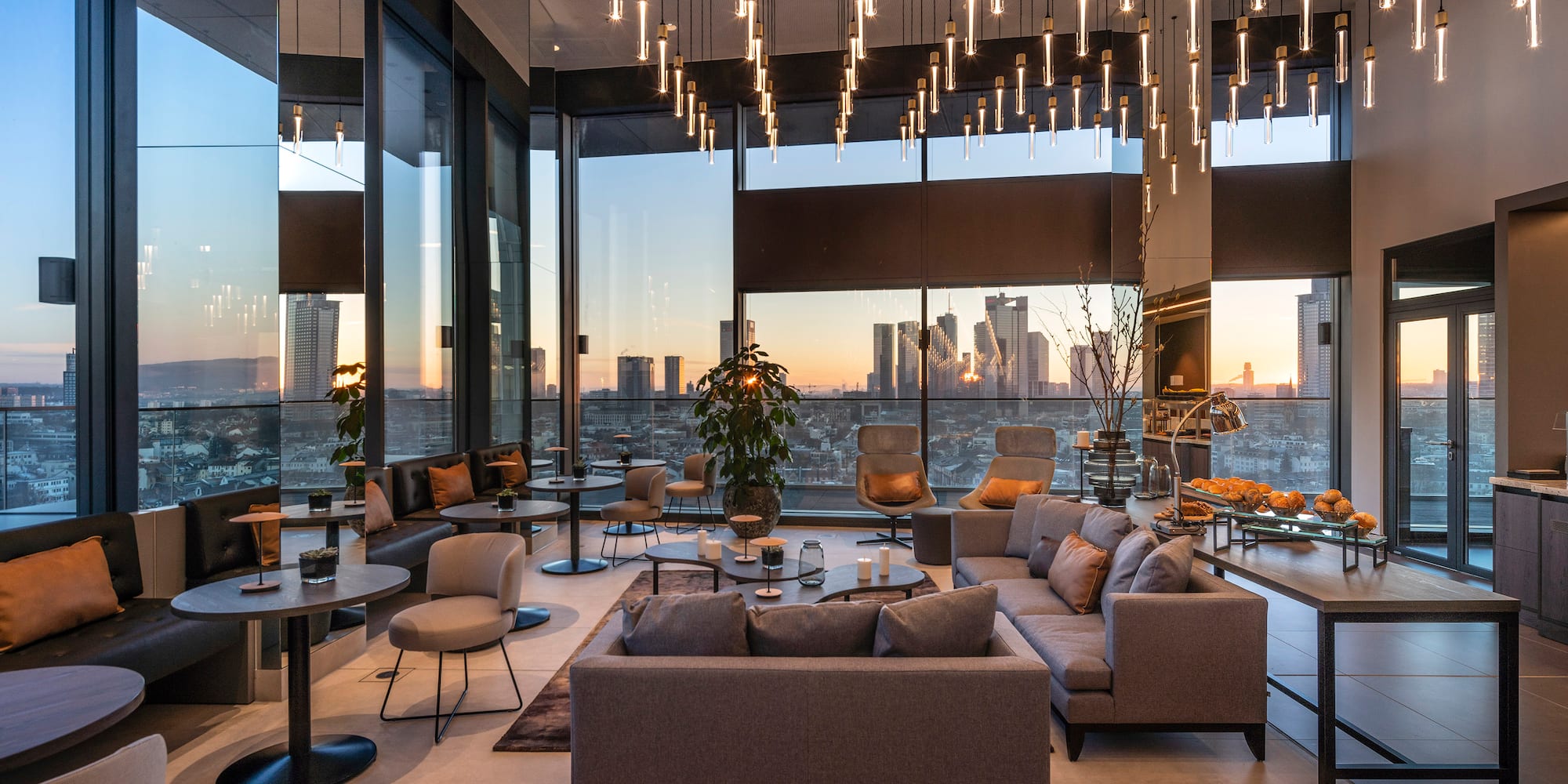 a room with a large window and a large city view