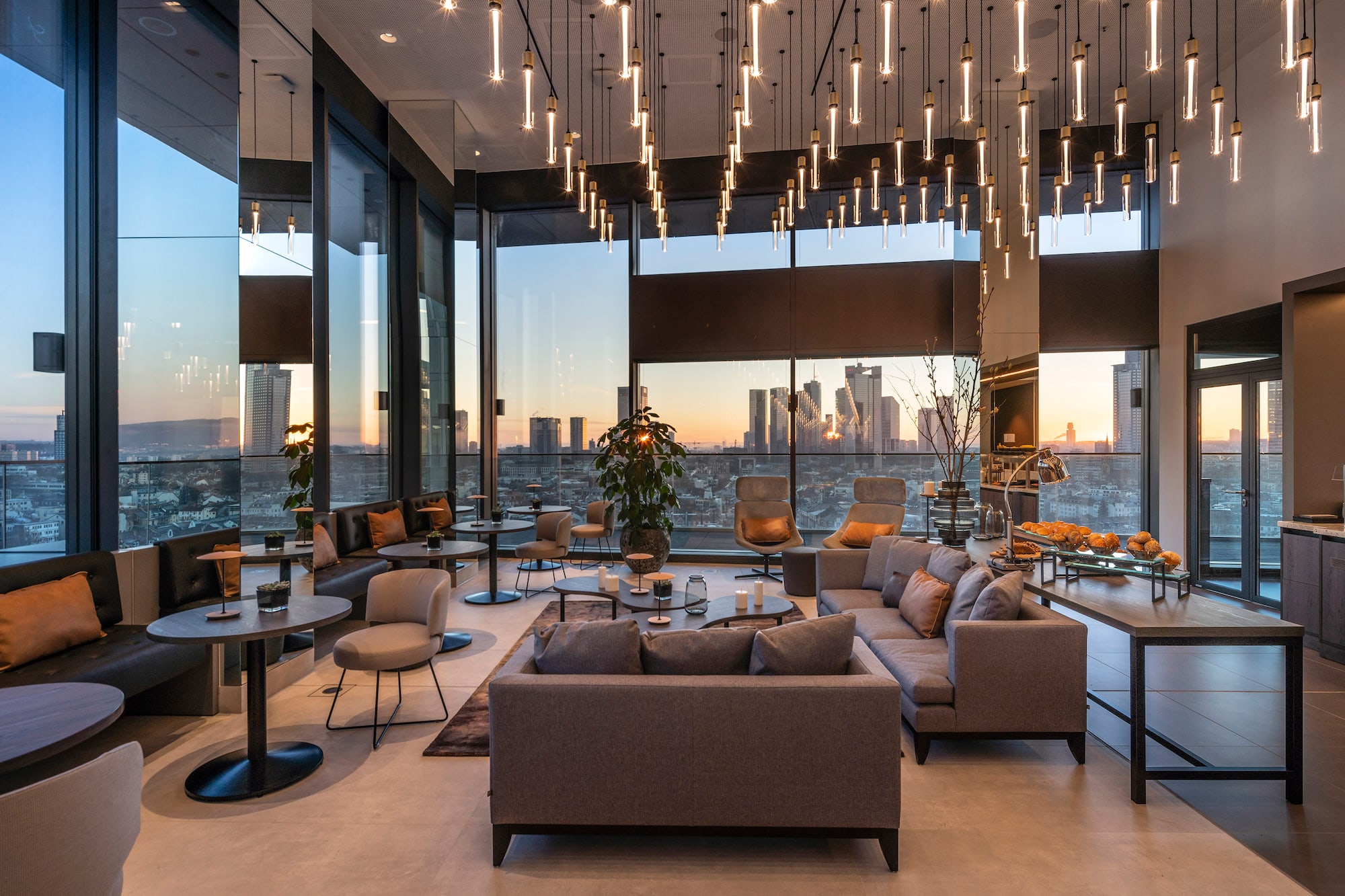 a room with a large window and a large city view