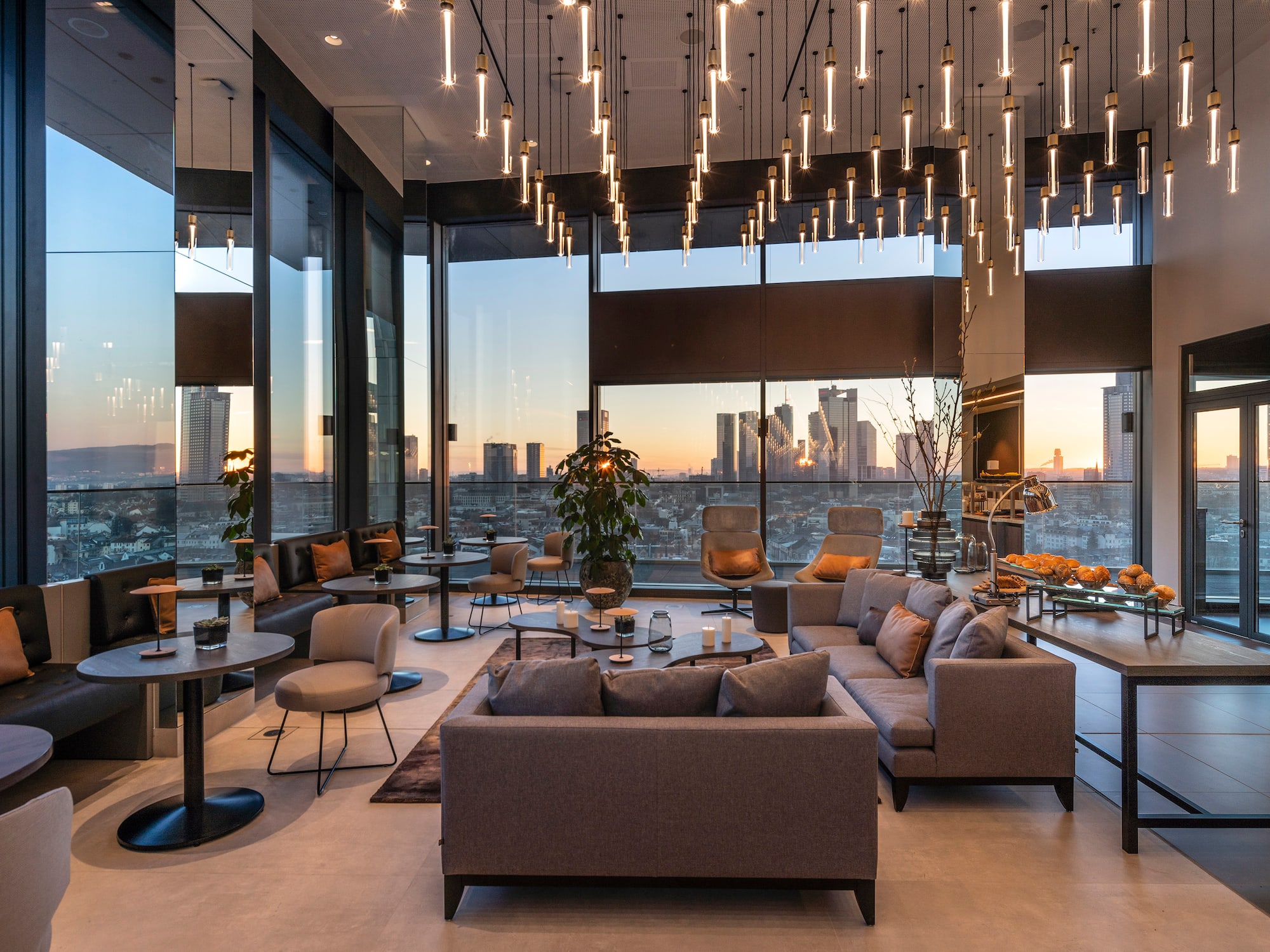 a room with a large window and a large city view