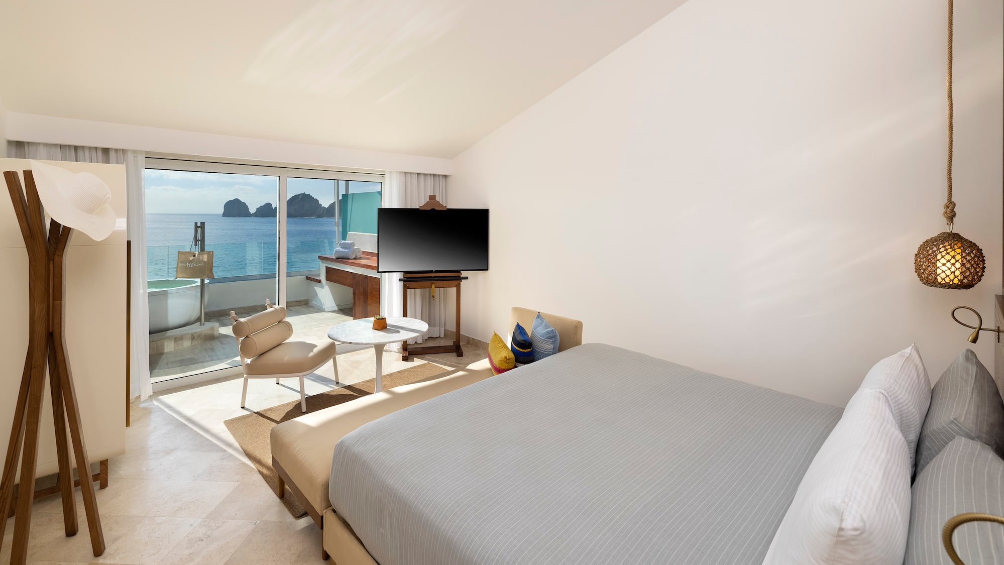 a bedroom with a television and a table