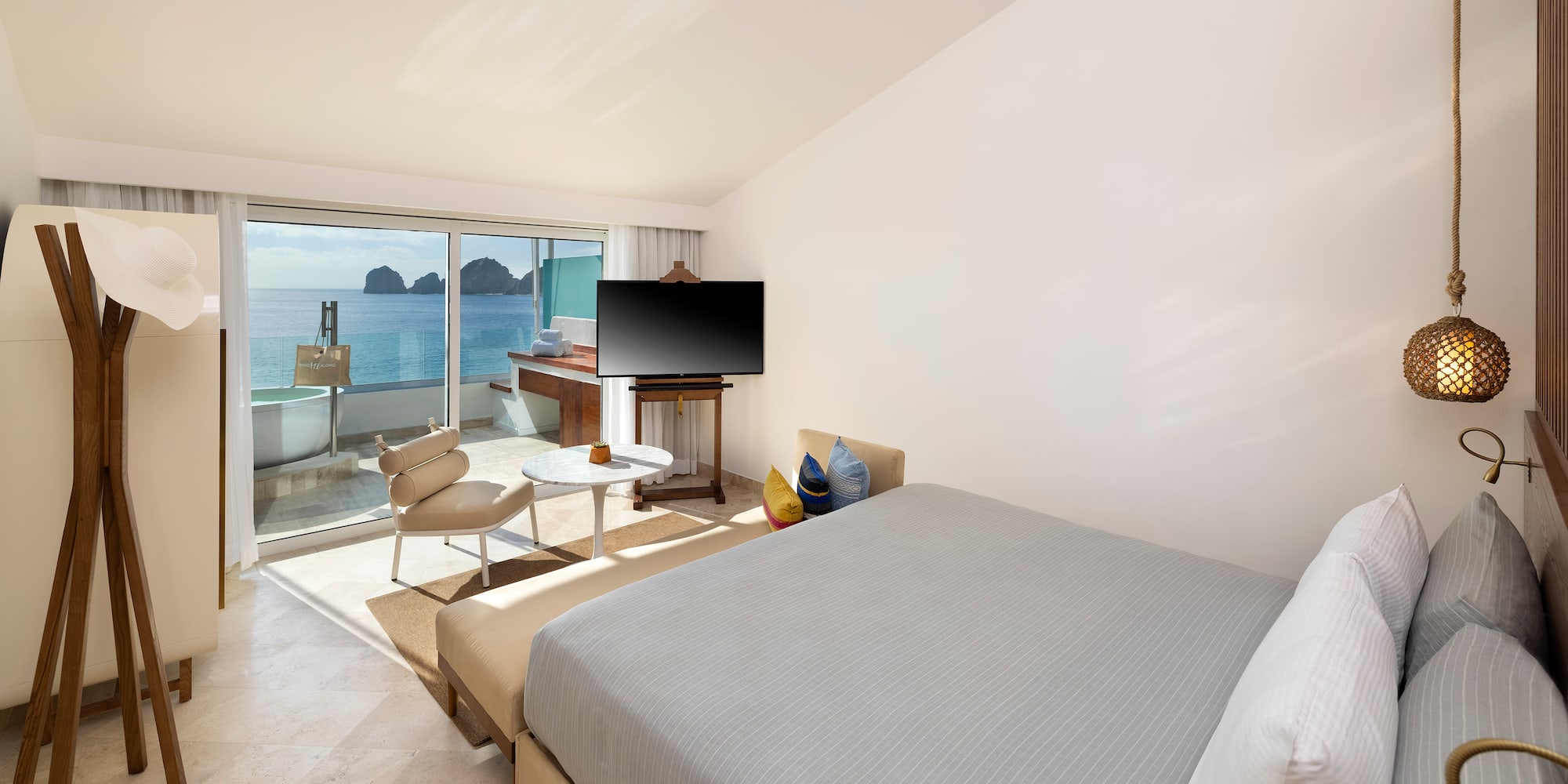 a bedroom with a television and a table