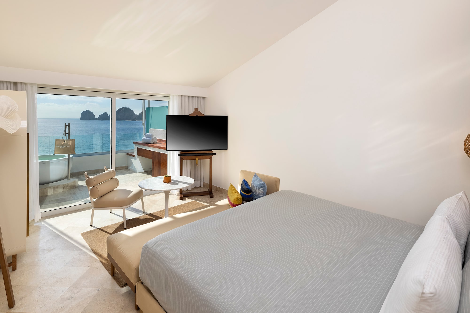 a bedroom with a television and a table