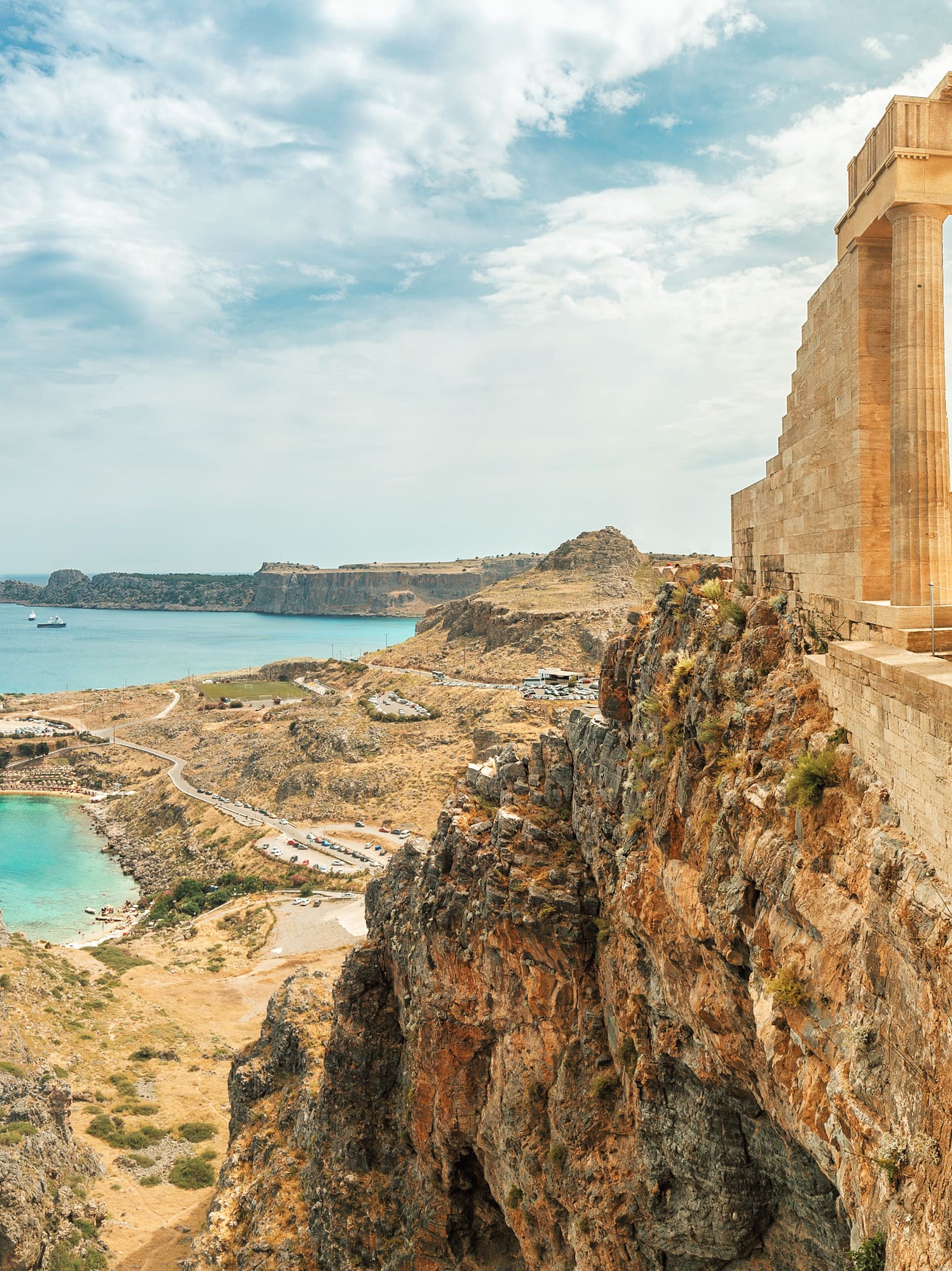 a stone building on a cliff