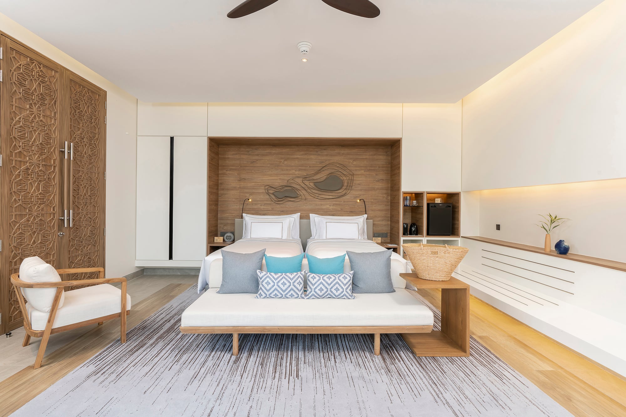 a room with a bed and a fan