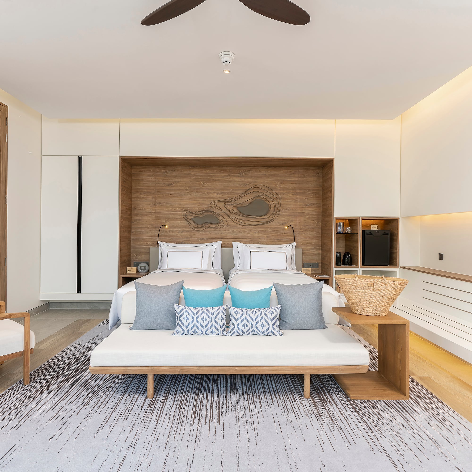 a room with a bed and a fan