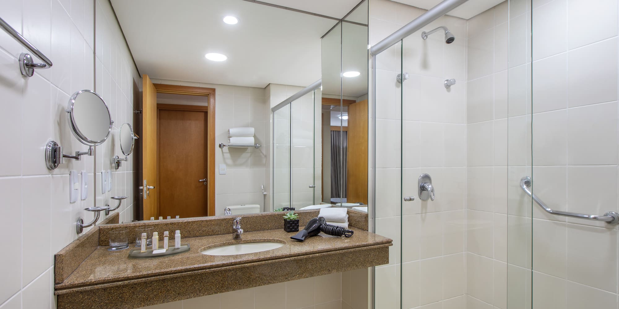 a bathroom with a shower and sink