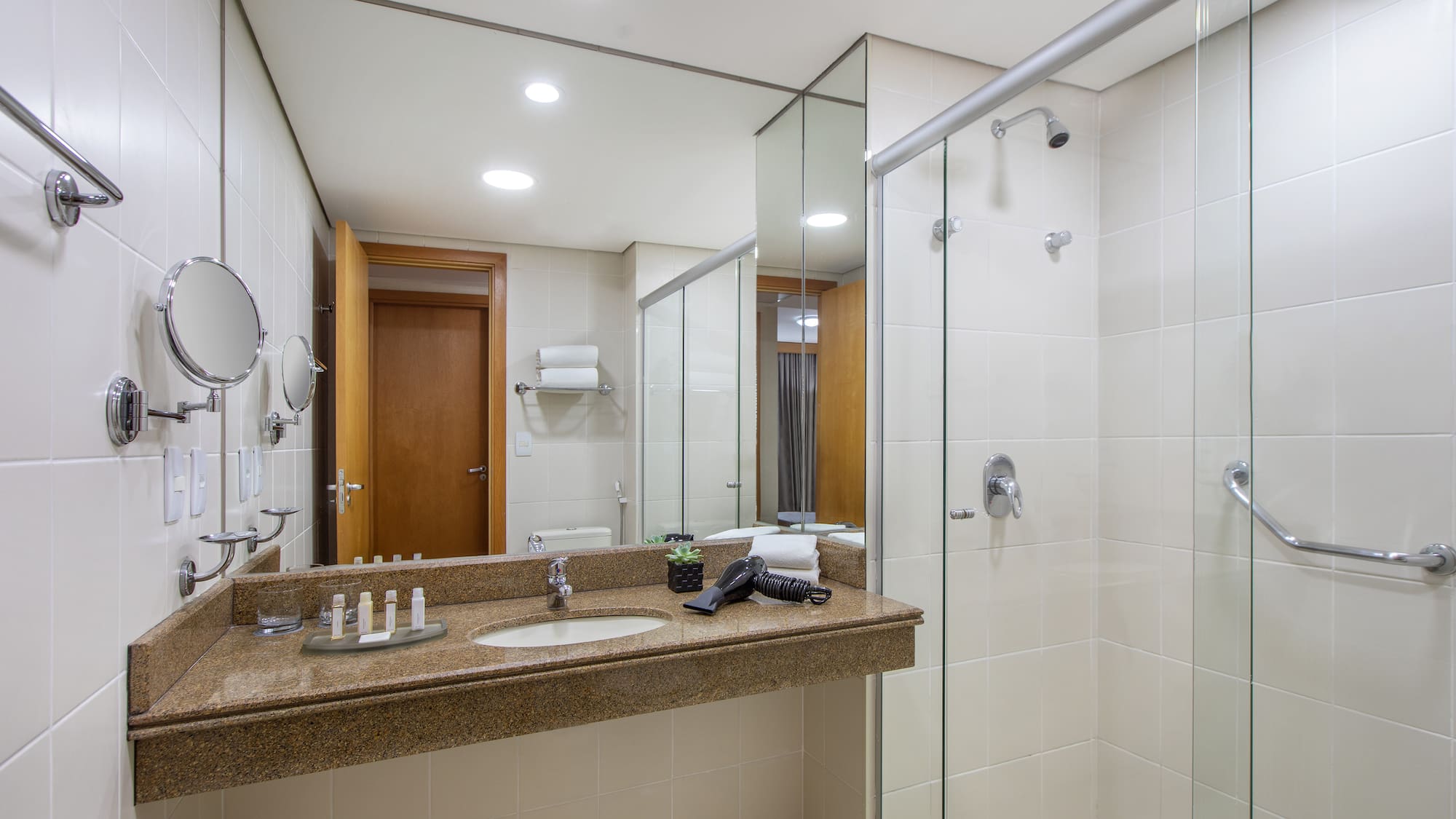 a bathroom with a shower and sink