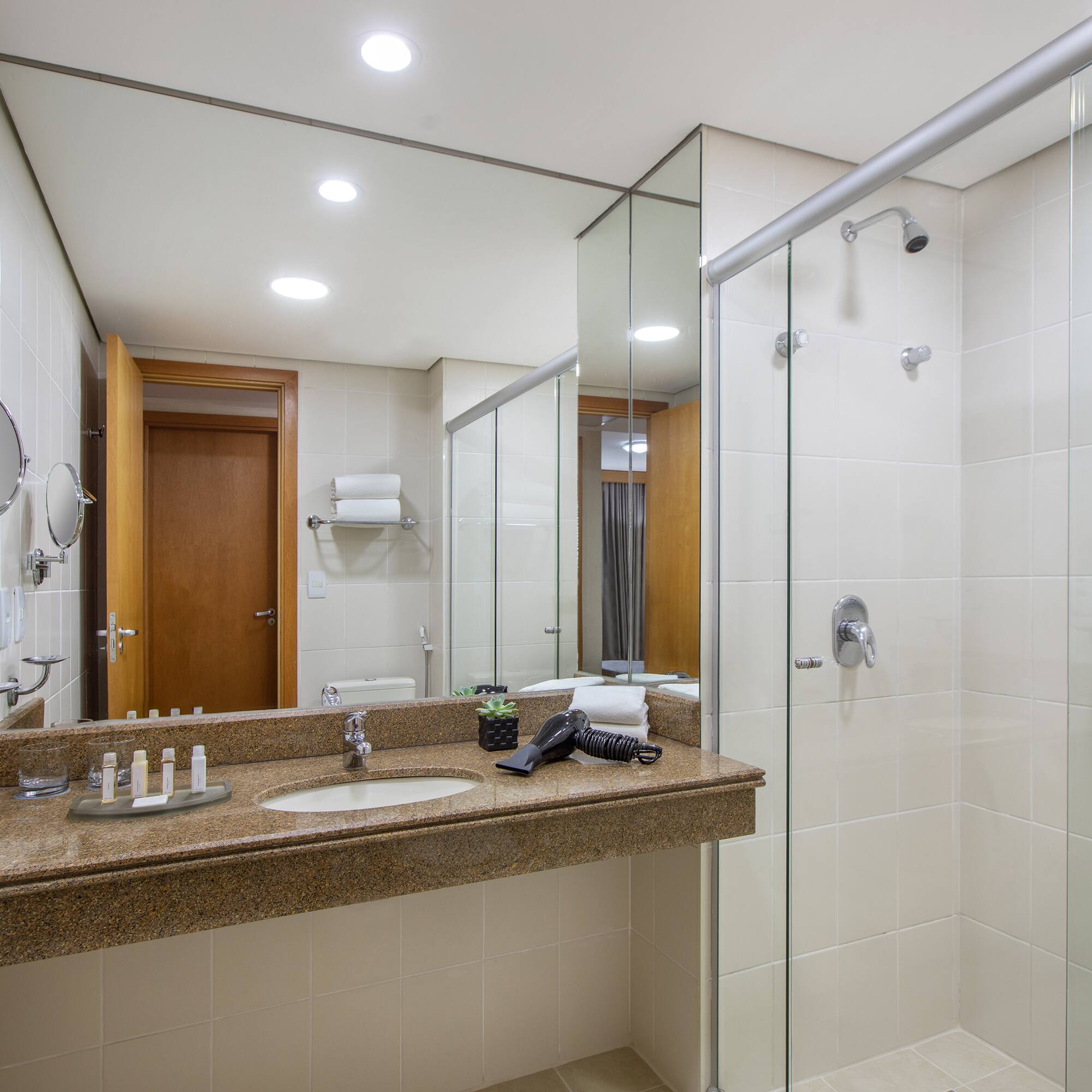 a bathroom with a shower and sink