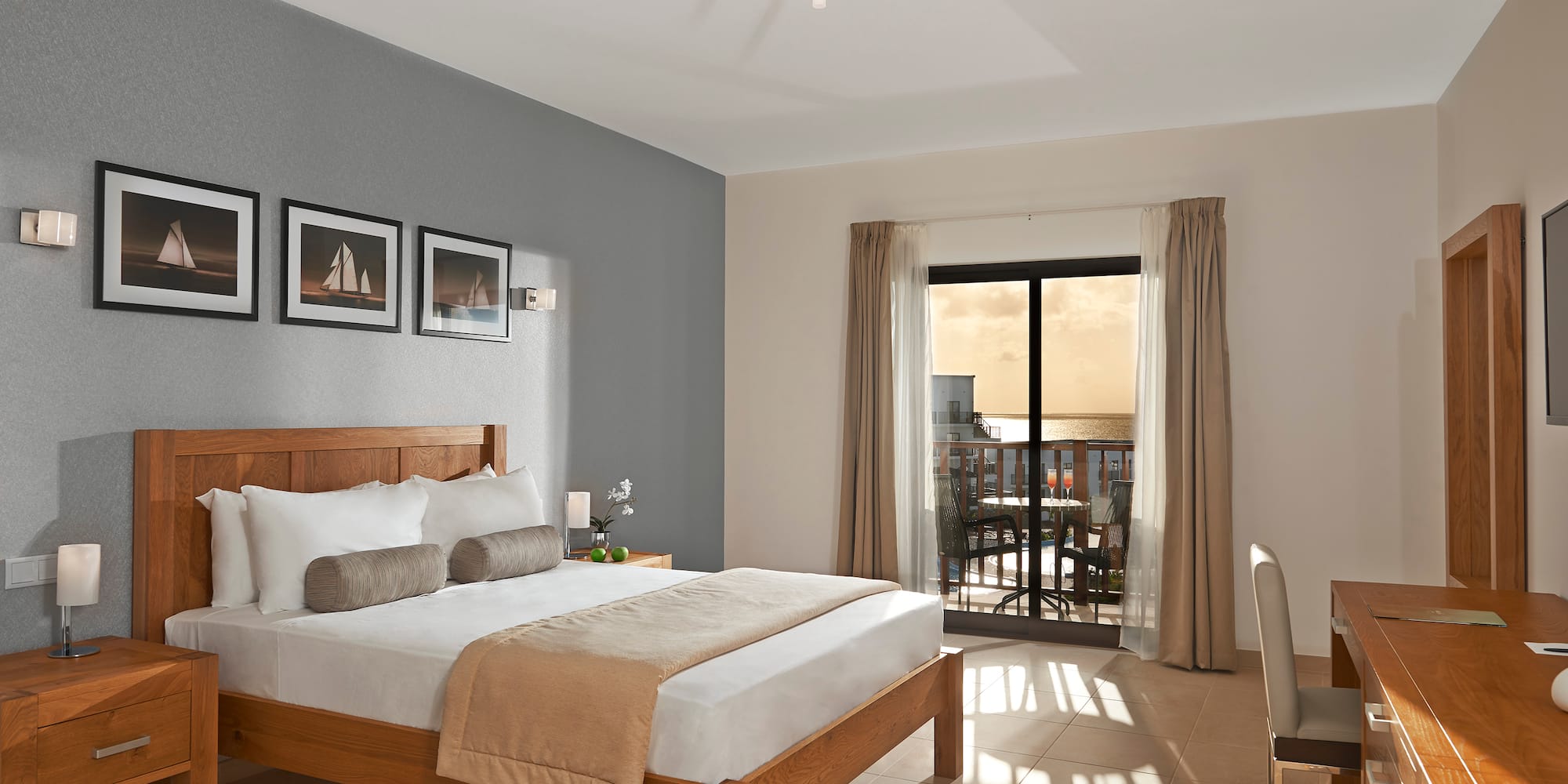 a bedroom with a bed and a glass door