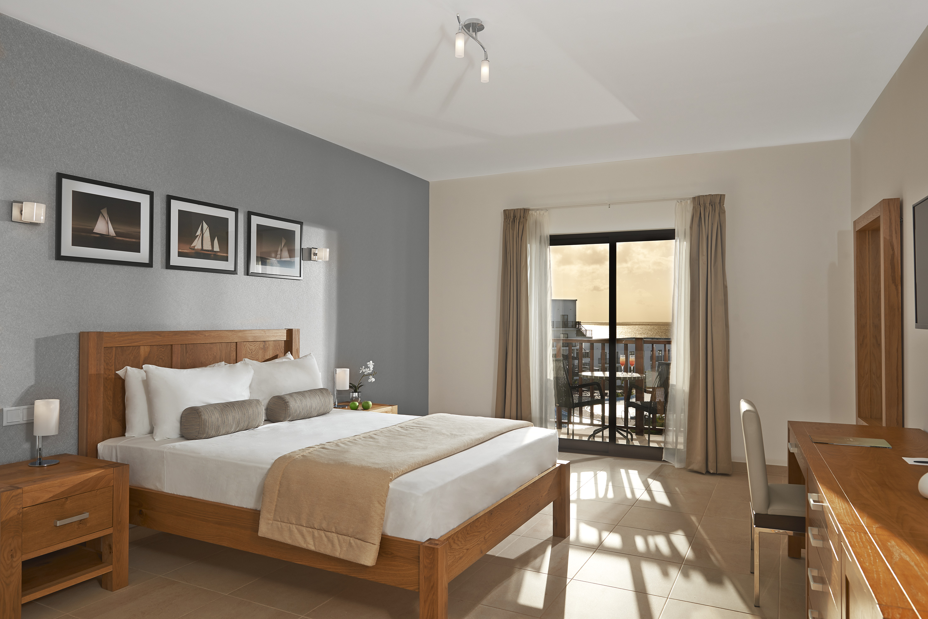 a bedroom with a bed and a glass door