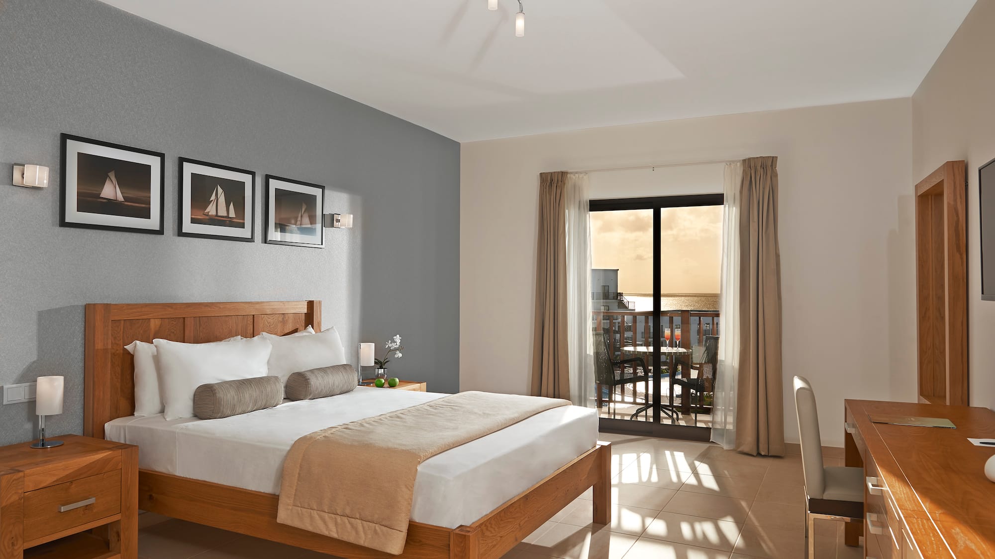 a bedroom with a bed and a glass door